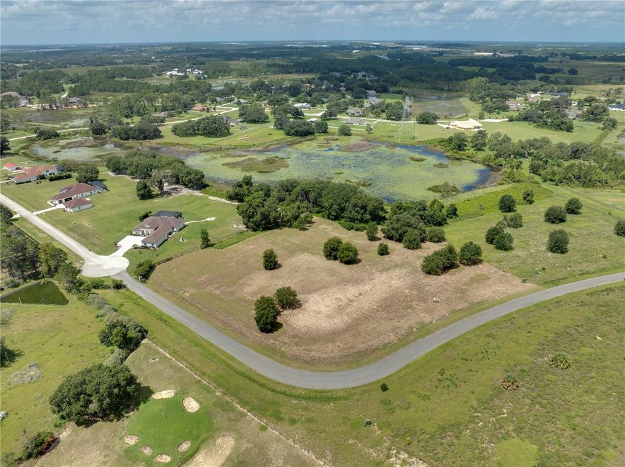 Rare Waterfront Opportunity in Clermont! Welcome to your future dream home site - nearly 4 ACRES of HIGH AND DRY land tucked at the end of a cul-de-sac in the sought-after community of Arrowtree . This waterfront lot offers the perfect balance of peaceful privacy and convenience. Whether you're dreaming of a private retreat, a homestead, or a custom-built estate, this property has everything you need. There is plenty of space for farm animals, wide open green areas, and mature natural surroundings that create a tranquil, scenic setting. Featuring mostly cleared land and a WELL already installed, saving you both time and money in the building process. A full survey is available, along with city-approved plans for a residential home-though you're also welcome to bring your own vision and design the home of your dreams. Enjoy peaceful water views, the comfort of good neighbors nearby, and easy access to local shops, schools, highways, and amenities. Opportunities like this are rare, with only a few lots remaining in this exceptional neighborhood. Schedule your private tour today and see the potential for yourself!