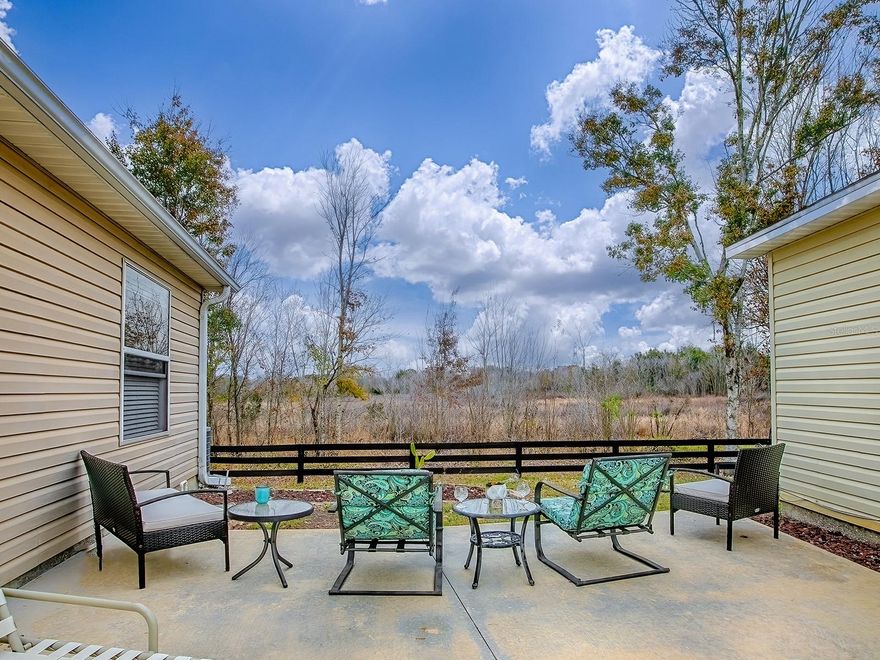 STUNNING PRESERVE VIEW ~ No backyard neighbors.  2/2  Colony Patio Villa.  NO BOND ~ NO CARPET ~ NEWLY RENOVATED.  Kitchen has Quartz Counters, Stainless Appliances, Glass Tile Backsplash and White Shaker Cabinets.   Open Concept with long breakfast bar and beautiful tile through main living area with lovely laminate in bedrooms.  Primary bedroom has WALK-IN Closet, Stone Counters in Bathroom with Step in Shower.  Guest bedroom is large and has a double door closet.  Guest bath has stone counters and tub shower combo.   ENCLOSED LANAI with double pane sliding windows, Privacy Shades and Tile Floor.  Your PRIVATE Side Yard has an EXTENDED Patio for your beautiful scenic view of the water preserve.  Totally Shaded in the morning and evening!  This patio villa has overflow parking across the street.  Located in the VILLAGE of RIO PONDEROSA, you will be a short golf cart ride to Spanish Springs and Lake Sumter Landing, Publix, Target and an abundance of shopping.  Enjoy a variety of Championship and Executive Golf Courses.  Neighborhood and Family Pools are right around the corner as well as the Recreation Centers with Pickleball, shuffleboard and more games.  This is the ONE – OF – A – KIND!!!  Schedule your appointment to see it.