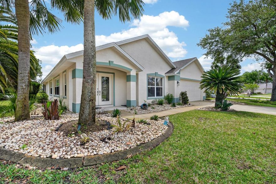 Beautifully updated and move-in ready, this 3-bed, 2-bath, 2,172 sq ft home is tucked inside the gated Plantation Bay Golf & Country Club, offering serene water and park views in Ormond Beach.

Step inside to an inviting, open layout highlighted by ceramic plank wood-look tile, coastal paint tones, and stylish fixtures that create a light, relaxed feel throughout. The spacious living and dining areas flow seamlessly into a bright kitchen featuring quartz countertops and ample cabinetry, making everyday cooking and entertaining easy. A wall of windows and sliders draws your eye outside to nearly panoramic vistas of the backyard lake and the lush Prestwick Park directly across the street, complete with a gazebo, lake with fountain, and shady sidewalks.

The private primary suite offers peaceful water views and an en-suite bath, while two additional bedrooms and a second full bath provide comfortable space for family or guests. Step out to the large screened lanai overlooking the lake, the perfect spot for morning coffee, evening wine, or weekend gatherings by the water. Situated on a corner lot, the home enjoys extra elbow room and curb appeal, plus a 2-car garage and separate laundry room for added storage and convenience.

Residents of Plantation Bay appreciate 24/7 manned gates and the option to join various club memberships that can include golf, two pools, cabana, fitness center, and a stunning new clubhouse with golf course views—membership is available but not required. With a 2001 build, newer cosmetic updates, and a low-maintenance 0.15-acre lot, this property lives like a modern retreat while keeping ongoing upkeep simple. All of this is just a short drive to Ormond Beach’s restaurants, shopping, and sandy shores, offering the ideal blend of resort-style living and everyday convenience.