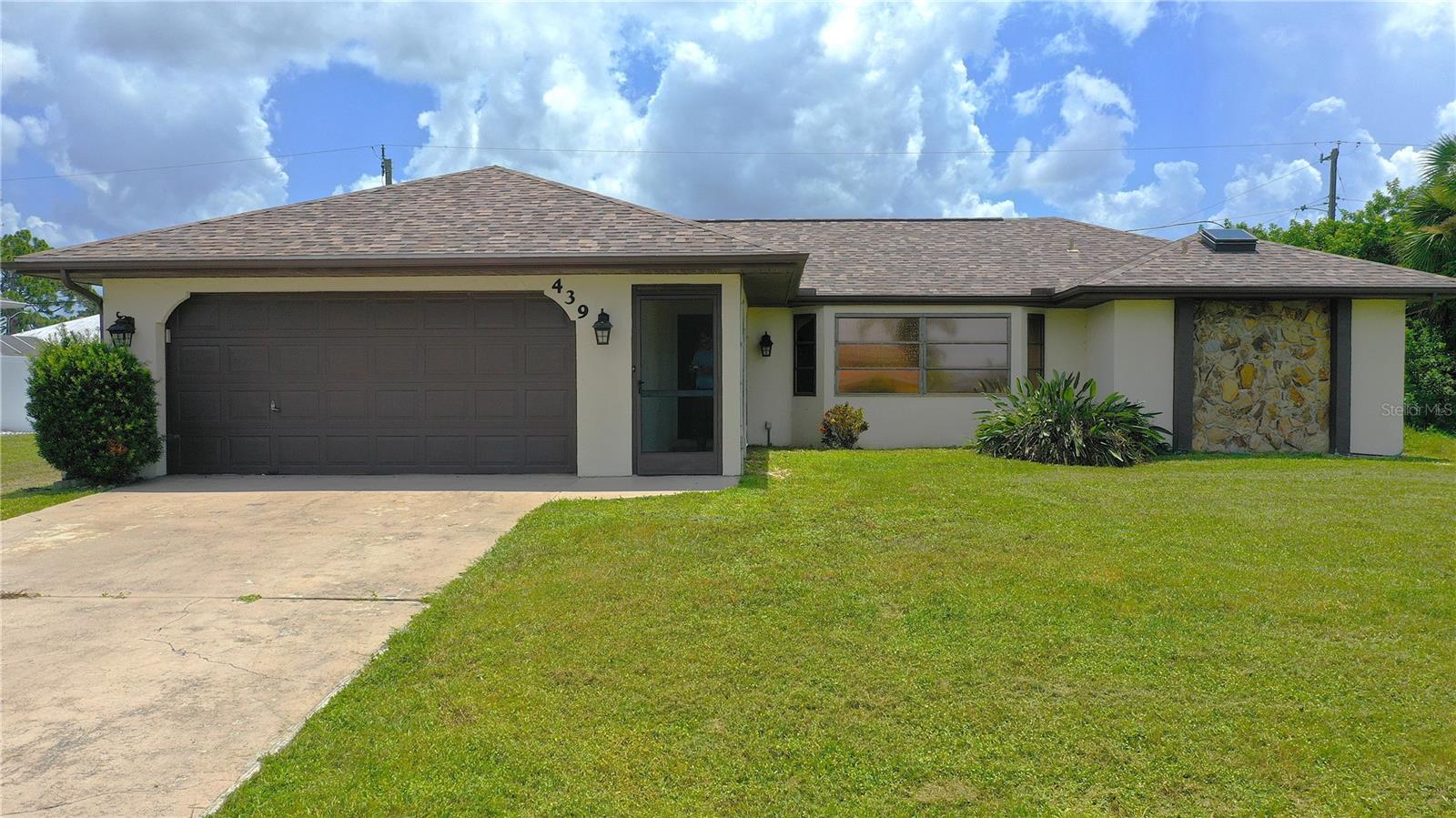 Discover your dream home at 439 Spring Lake Blvd, Port Charlotte, FL! This beautifully maintained 3-bedroom, 2-bathroom single-family residence offers 1,622 sq ft of modern living space, nestled in the heart of Port Charlotte. With a 2-car attached garage, inside laundry, and a host of desirable features, this home is a rare find that blends comfort, style, and functionality. Step inside to a layout filled with natural light, showcasing a spacious living area ideal for entertaining or cozy family nights. The large kitchen boasts ample cabinetry, Granite Counters, Newer appliances, and a convenient dinette/breakfast area. The Primary suite is a true retreat, complete with a generous walk-in closet and an en-suite bathroom featuring a Dual sink vanity, a tub/shower combo PLUS a separate shower stall, and a water closet. The two additional bedrooms and Guest Bathroom provide plenty of space for family, guests, or a home office. Outside, enjoy Florida living at its finest on the LARGE covered & screened-in lanai—perfect for sipping morning coffee or hosting summer barbecues. The partially fenced backyard offers privacy and room for outdoor activities, while a detached shed provides extra storage for tools, toys, or hobbies. The well-manicured lot enhances the home’s curb appeal, making it a standout in this sought-after neighborhood. This home is located just minutes from Major roads and Highways, pristine Gulf beaches, schools, shopping, dining, and recreational hotspots like the Tampa Rays Baseball Spring Training Complex and nearby parks. The 2-car garage ensures ample parking and storage, while the inside laundry adds everyday convenience. Whether you’re a first-time homebuyer, growing family, or looking for the perfect Florida retreat, this move-in-ready gem checks all the boxes. Don’t miss your chance to own this slice of paradise in one of Port Charlotte’s desirable areas. Schedule your private tour today and experience the charm of 439 Spring Lake Blvd for yourself!