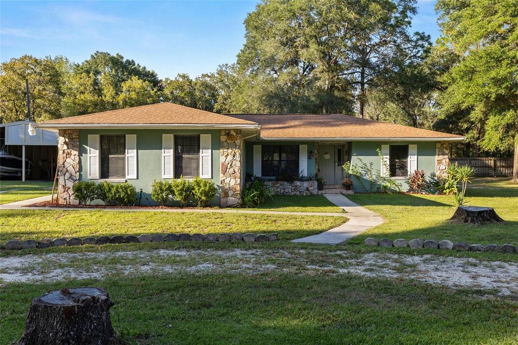 Photo of 12025 SW 103rd Lane, Dunnellon, FL 34432 (MLS # OM710548)