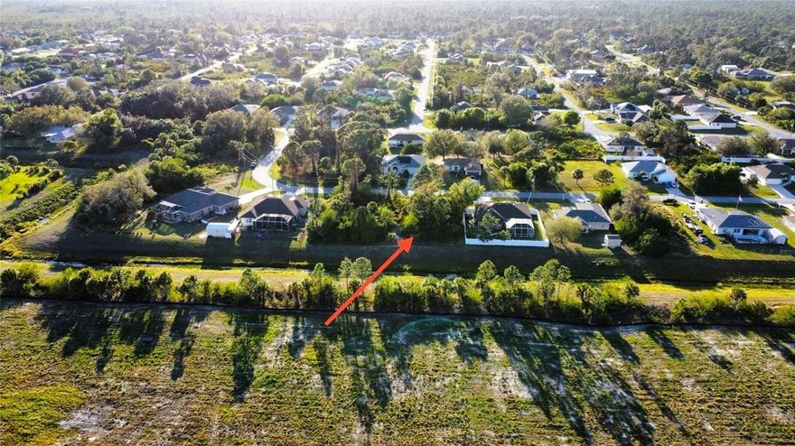 Build Your Florida Dream Home! Discover the perfect homesite in a quiet, family-friendly neighborhood with no deed restrictions or HOA, giving you the freedom to build and live the way you choose. Enjoy a peaceful, private setting that still offers excellent convenience, with easy access to I-75 for a smooth commute to Sarasota or Fort Myers. You’ll be close to everything North Port has to offer, including shopping centers, parks, schools, and popular dining spots. The canal behind the lot adds an extra layer of privacy once your home is built. Located in an X flood zone, this property can help you save thousands on construction and insurance costs. Just 3 miles from Warm Mineral Springs and less than 30 minutes to beautiful Englewood Beach, this is the ideal spot to make your Florida dream a reality. 
Don’t wait—call today!