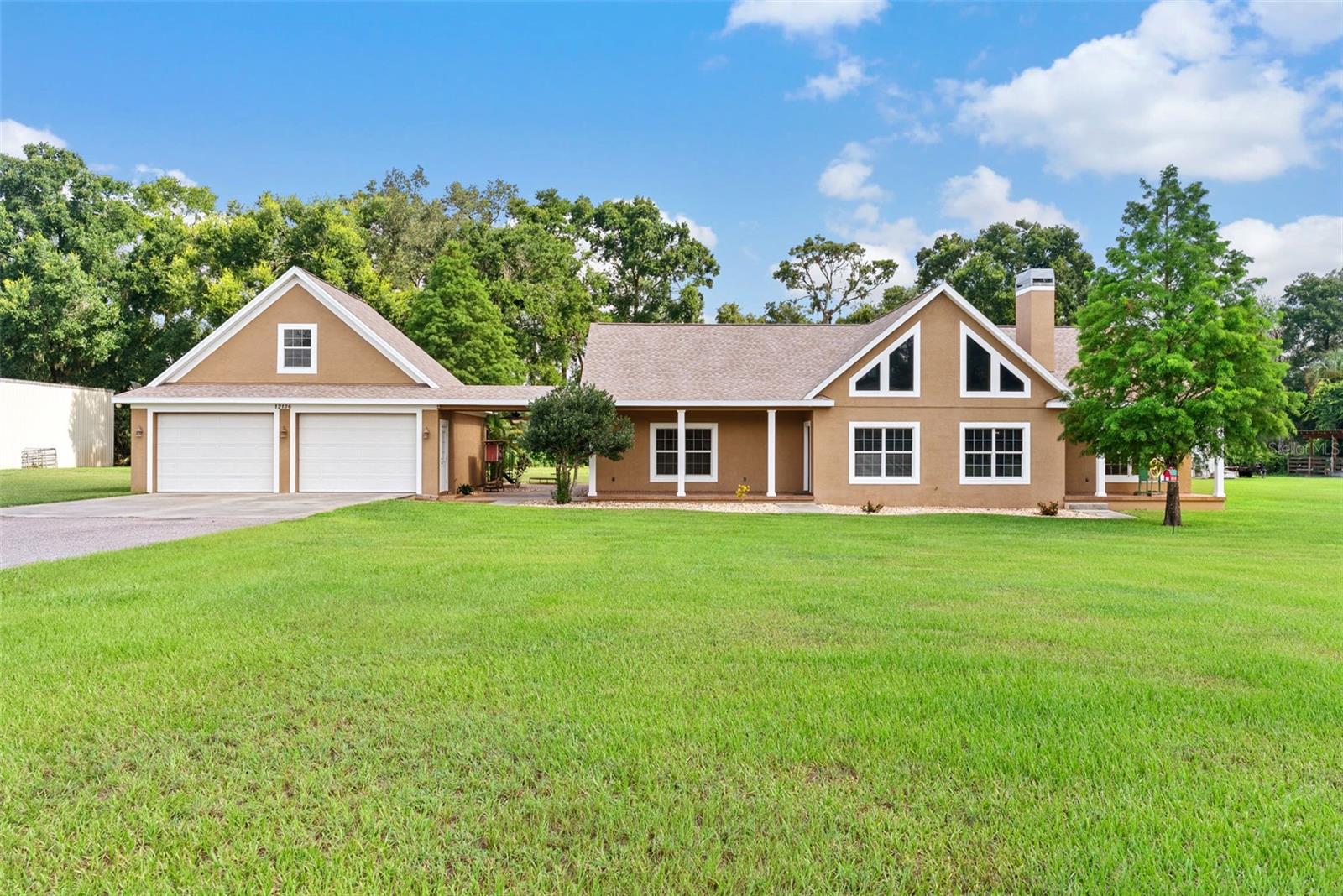 COUNTRY ESTATE! Exquisite Custom Built Pool Home on 1.5 acres. This home has upgrades throughout. The split plan features the Primary bedroom (19'x15'10") with a huge walk in closet and a huge bathroom with an oversized shower. This property features a bonus room upstairs over the garage. The large Great Room has a beautiful Cedar cathedral ceiling and absolutely stunning windows! The screened patio has beautiful brick pavers open to the pool area. There is a water softener system, a fire pit, sold wood doors throughout, etc.  There is a Generac Generator that will power the entire home (Warranty good to 2027). New roof in 2024 and New A/C in 2025. The Great Room has a wood burning fireplace. There are 9'4" ceilings throughout the home. There is a breezeway to the oversized (30/x24") garage.  There is a huge all metal workshop on the property - 46' x 36' (40' x 36' with 6" concrete floor for heavy duty equipment. The workshop three (10'x12') roll up doors.  No detail has been overlooked.