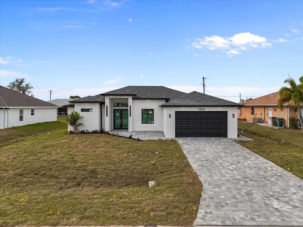 Photo of 1310 NE 7th Place, Cape Coral, FL 33909 (MLS # O6378228)