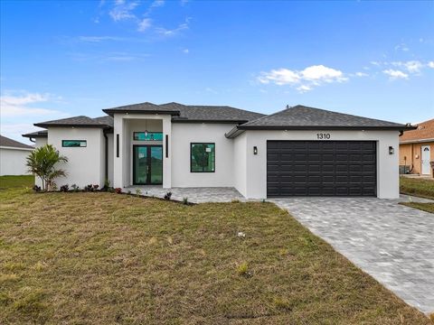 Photo of 1310 NE 7th Place, Cape Coral, FL 33909 (MLS # O6378228)