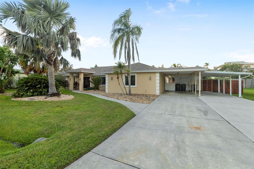 LOCATION, LOCATION, LOCATION....a bridge away from Siesta Key!  SPACIOUS and CONVENIENT this residence features 3 generously sized bedrooms plus a versatile bonus room---perfect for a home office, playroom, or 4th bedroom.  The OPEN FLOOR PLAN, offers multiple sitting areas, ideal for both relaxing and entertaining.  The eat-in kitchen is a chef's delight, complete with stainless steel appliances, a center island, and plenty of room for gathering.  Cozy up in the den for movie nights or family game time.  Step outside to your own tropical oasis.  Enjoy the fully enclosed caged pool deck surrounded by swaying palm trees, string lights, and various seating areas that create a magical ambiance.
There is a built-in barbeque and ample yard space outside of the pool cage allowing plenty of room for your dogs to run freely.  The yard is fully enclosed with a brand new fence.  All windows and doors are IMPACT and FULL ROOF REPLACEMENT one year ago.  Additional features include indoor laundry, generous closet space, and extra outdoor storage.  Enjoy the proximity to the world-famous crystal sand beach of Siesta Key, restaurants, boat rentals & shopping.  Whether you are looking for a full-time residence or a place for family vacations that you can rent out when not in use, this home offers the perfect blend of comfort, space and location.  Come live the Florida lifestyle in a beautiful family home where you can truly spread out and enjoy!  Comes FULLY - FURNISHED.