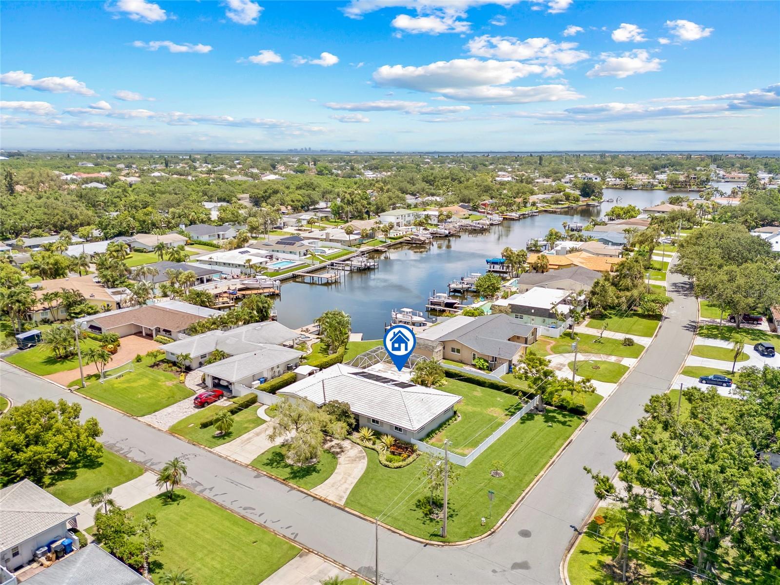 One or more photo(s) has been virtually staged. Waterfront living meets peace of mind in this beautifully upgraded St. Pete home!
Welcome to your own slice of Florida paradise! Located in the sought-after North East Park Shores neighborhood, this beautifully maintained 2-bedroom, 3-bath waterfront home sits on an oversized, professionally landscaped corner lot. With its spacious layout, thoughtful upgrades, and tranquil water views, this is a rare opportunity to own a waterfront property in one of St. Pete’s most desirable communities.
Enjoy direct water views from most rear-facing windows and entertain with ease in the screen-enclosed solar-heated pool—complete with a 2024-installed pool heater and resurfaced with Fibre Tech in 2023. The covered patio offers a peaceful and private setting for morning coffee or evening gatherings, all overlooking the serene waterfront. A private dock with electricity and a light extends your living space to the water—perfect for starting your day with coffee or winding down with a sunset drink.
The kitchen is bright and functional, featuring abundant storage, new stainless steel appliances including a range, refrigerator, microwave, garbage disposal, and a Bosch dishwasher—all positioned to take in the beautiful pool and water views.
A flexible bonus room, currently used as a den, includes built-in bookcases, a vent-free gas fireplace, closet space, and a private en-suite bath. This space can easily serve as a third bedroom, home office, or guest suite.
The home has improved windows and doors, including the overhead garage door, that meet Miami-Dade codes and are rated to Missile Level D, providing the strongest hurricane protection. A Trane high-efficiency HVAC system and ductwork installed in 2023, and a whole-house natural gas generator with automatic transfer switch adds to the upgrades of this beautiful home. The interior and exterior were freshly painted in 2022, and the newly installed sprinkler system (using reclaimed water) supports lush CitraBlue St. Augustine sod replaced in 2024.
The gated side yard provides space to store an RV or boat trailer, the vinyl fencing around four sides of the property and complementary Podocarpus hedging add privacy and charm. Best of all, this elevated home has never flooded—even during major storms like Hurricanes Helene and Milton.
Don’t miss this rare chance to enjoy the waterfront lifestyle in North East Park Shores. This is more than a home—it's a lifestyle of comfort, serenity, and stunning waterfront beauty. Schedule your private showing today and discover the best of coastal Florida living.