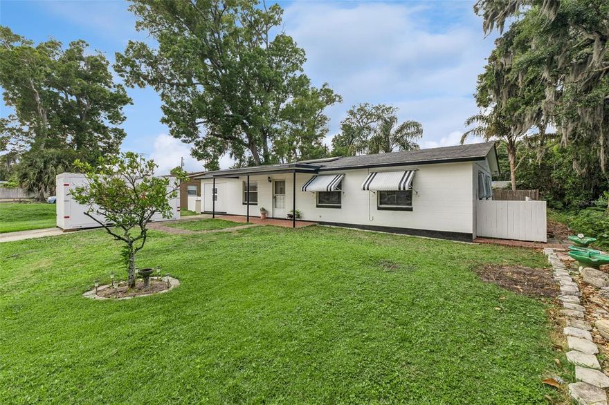 Welcome to your charming new home at 1152 Pineview Drive in Daytona Beach. Picture yourself in this delightful single-family residence, perfectly situated at the end of a serene cul-de-sac. As you approach, you'll be greeted by mature landscaping and a lush garden view that immediately evokes a sense of tranquility. The inviting front porch is perfect for enjoying your morning coffee while the rear porch offers a quiet space to unwind. Step inside to discover a thoughtfully designed space where natural light fills the living room, highlighting the tile flooring and ample room for relaxation. The kitchen is a functional delight with white cabinetry, tile flooring, and seamless access to the laundry room equipped with essential appliances. Imagine preparing meals while enjoying the garden views from the window. Your primary bedroom features a built-in closet and laminate flooring, providing a cozy retreat at the end of the day. The additional bedrooms offer comfortable carpeting and generous space for guests or an office. The two bathrooms are styled with classic tile work, exuding a vintage charm. The bonus room adds flexibility to suit your lifestyle needs, whether it's a creative studio or additional living space. The exterior's block and stucco construction, complemented by rain gutters and patio doors, ensure durability and style. A spacious driveway will accommodate your parking needs.  Electric heated and centrally cooled, this home ensures comfort year-round, with BB/HS Internet and cable available to keep you connected. Located near the Tanger Outlets and with easy access to local beaches, this home offers both convenience and leisure.  Make this delightful house your new home and experience the best of Daytona Beach living. Schedule a viewing with a one-hour notice to start your next chapter at Pineview Drive.