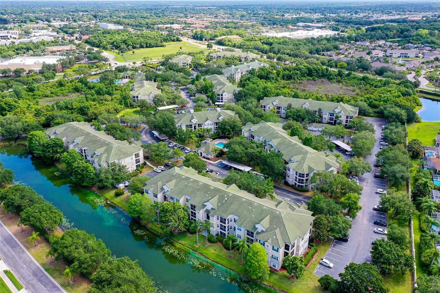 Palmer Ranch, a rarely available three-bedroom, two-bath corner unit condominium on the second floor with an outside storage closet. This is the largest condo with 1,376 square feet, and quality construction. Overlooking the Lake and complete privacy, this condo has been tastefully updated with neutral tile throughout, split bedrooms, a large walk-in closet in the primary bedroom, remodeled bathrooms, high ceilings, crown moldings, and an inside laundry center. The kitchen has newer appliances with a closet pantry. Optional one-car garage 9H available separately.  
Serenade’s resort-style amenities include two swimming pools, a recently refurbished hot tub, BBQ grilling areas, a 24-hour fitness center, clubhouse, on-site management, library, resurfaced tennis court, playground, business center, and car wash station. All building roofs have been recently replaced, and exterior painting of building 9 is scheduled for 2026, enhancing the community’s safety and long-term value. Community is close to world-famous Siesta Key Beach with white sugar sand and the Legacy Trail for cycling, nature trails, and recreation. Palmer Ranch is convenient to Interstate 75, downtown Sarasota, outstanding schools, a variety of dining options, and more! Live the Lifestyle