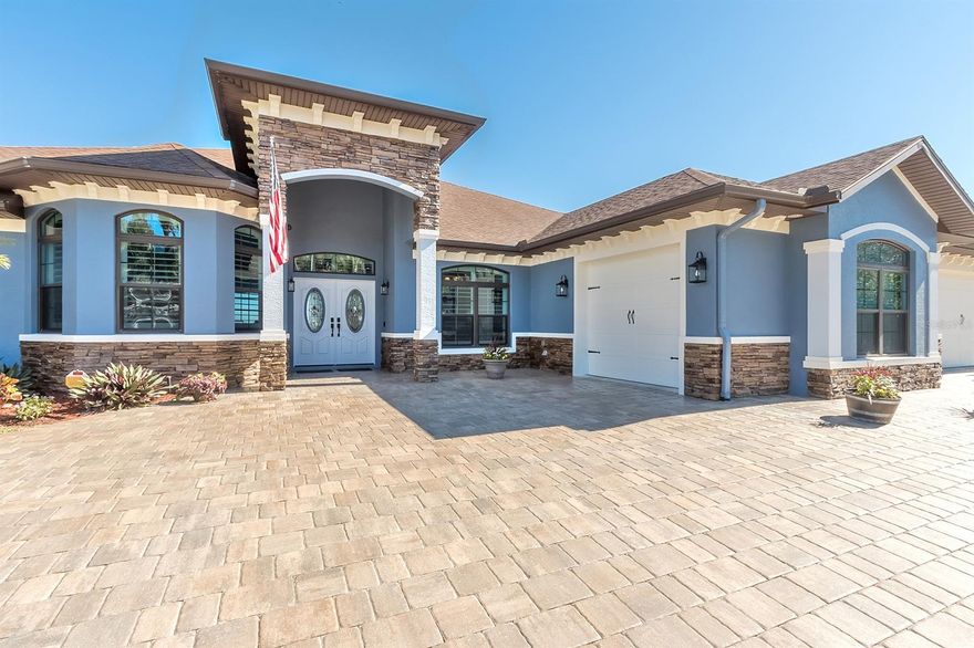 WATERFRONT!!! This is what Florida Life is all about right here. Whether you are looking for a vacation, retirement, second, permanent, or even rental home look no further, your dream is about to become reality. As you walk up the freshly sealed paver driveway you can’t help but notice the beautiful landscape, oversized 3 car garage, impact windows and a freshly painted palace. As the front door opens the magic begins. An unobstructed panoramic view of the Intracostal right there in your back yard. Truly a breathtaking masterpiece to come home to. Gorgeous teak flooring hug almost every inch of the main area and lovely tile encapsulates the amazing kitchen. The grand living room has unbelievable river views, an awesome coffered ceiling and hurricane rated sliding doors open all the way making the outside patio part of the party. Create gourmet meals in the "gathering room" (the kitchen) while still being a part of the conversation. Plenty of room to gather at the granite countertop, breakfast nook or formal dining room. Stainless steel appliances, (including gas range), copious granite countertops, huge pantry and enough cabinets to house the entire Martha Stewart collection. The 4 bedrooms are great in size and the mother in law suite has terrific river views. The captains quarters is ample and besides access to the pool area the walk in closet is a safe room. Outside you will find your GIANT 2600 sq ft patio and pool area. Relax in the 18x30 self-cleaning pool or soak in the hot tub maybe lounge on the couch while your favorite movie plays and the gas fireplace roars. Not only 2 covered areas but the start of a summer kitchen with gas hook up and outside the screen enclosure a 550 sq ft paver courtyard awaits. Take a walk to the river on your 280 ft long dock with 2 levels, floating dock, fish cleaning station, electric, water, and power for future boat lift. Can you watch a space launch from your pool? There is nothing like it! Come make this house your new home. ;Water: City