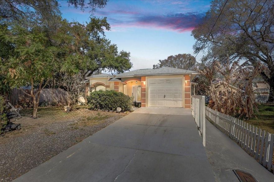 Your Dream Home Awaits! Welcome to this move-in ready 3-bedroom, 2-bath home with a 1-car garage, built in 2005 a rare find in this area! This well-maintained property features a NEW ROOF (2024), newer A/C unit, and newer water heater, giving buyers peace of mind for years to come. Step inside to a desirable split floor plan with vaulted ceilings that create an open and airy feel. The home offers beautiful wood cabinetry and a functional layout perfect for both everyday living and entertaining. The front bedroom and garage each have their own private entrance, providing added flexibility and convenience, ideal for guests, a home office, or multigenerational living. This home just needs a little TLC to truly shine — with a touch of care and personal updates, it can easily become the perfect place to call home and a great opportunity to build equity. Located just minutes from Downtown Tampa, the scenic Tampa Riverwalk, and approximately 20 minutes to Tampa International Airport, you’ll enjoy easy access to everything Tampa has to offer. Plus, NO HOA and NO CDD fees, giving you more freedom and lower monthly expenses. Don’t miss this opportunity — schedule your private showing today!