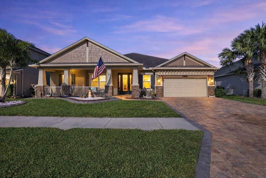 Welcome home to Arbor Woods luxury at its finest, with a sprawling and thoughtfully designed
floor plan that pairs upscale finishes with exceptional indoor-outdoor living. This 4 bedroom +
office, 3 full baths, 2 half baths home offers two first floor living spaces, a second floor loft, and
a truly standout backyard overlooking the water. The exterior sets an inviting tone with sidewalk
lined streets, a paver driveway, Hardie shake and stone accents, and a cozy covered front porch
that allows you to slow down and enjoy the setting. Inside, the home immediately impresses with
crown molding, tray ceilings, elevated lighting, warm neutral paint, shiplap feature walls, built-in
speakers, a central vacuum, and no carpet throughout. The expansive family room is designed for
entertaining and gathering, with recessed sliding doors that open wide to the outdoor living
space, creating a seamless transition and showcasing peaceful water views. The kitchen
overlooks it all, making hosting effortless. It offers a central island with breakfast bar seating, a
Monogram built-in double oven, a gas cooktop with pot filler, a walk-in pantry, coffee nook, and
a cozy eat-in dinette to keep conversations easily flowing. For more formal gatherings, the
dedicated dining room sits near the front of the home, complete with a statement chandelier and
wainscoting details. Nearby, the private office is tucked away from the main living areas,
offering a quiet and functional workspace. Additional living spaces include a media room at the
rear of the home and an impressive 18x19 second floor loft featuring a wet bar, beverage
refrigerator, and convenient half bath, creating the perfect space for movies, guests, or even a
game room! The primary suite is privately positioned on the first floor and features direct access
to the patio through French doors, along with a serene and well appointed ensuite bathroom. A

unique highlight is the adjacent bedroom that has been transformed into a massive custom walk-
in closet with built-in organizers and a chandelier, while still offering the flexibility to easily

convert back into a bedroom. It shares a Jack and Jill bathroom with the third bedroom. Bedroom
four is located on the opposite side of the home near a full bath, providing an ideal guest setup.
Outdoors, the backyard has been thoughtfully designed for year round enjoyment. The paver
patio features an outdoor kitchen, fire pit, covered seating, open seating, and a charming swing
overlooking the pond, creating a space that feels like the epitome of relaxed Florida living.
Located within the gated community of Arbor Woods, residents enjoy access to a swimming pool
and playground, all just minutes from Tampa Premium Outlets, Wiregrass Mall, major highways,
and everyday conveniences. Reach out today for more details or to schedule your private
showing!