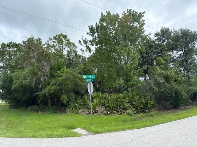 Beautiful wooded corner lot located at 1 Watkins Place in Palm Coast, FL. Nestled in a quiet neighborhood, this property offers a wonderful opportunity to build your dream home. Conveniently situated close to Pine Lakes Golf Course, churches, shopping centers, and just a short drive to the beautiful beaches of Flagler County. Enjoy the Florida lifestyle with nearby parks, walking trails, and all the amenities Palm Coast has to provide.