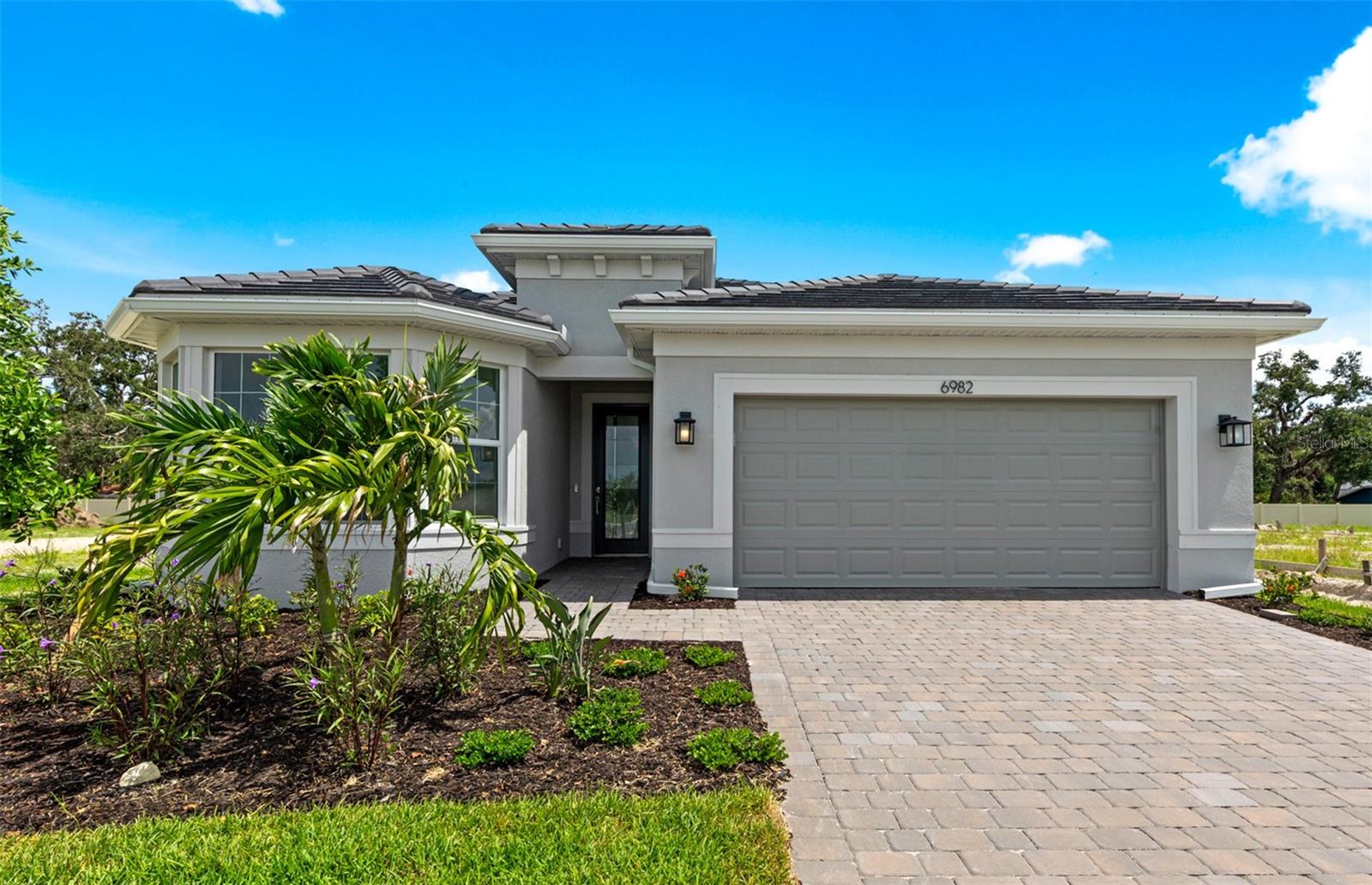 Step into luxury with this one-of-a-kind Prosperity home, nestled in an exclusive gated community that promises a maintenance-free lifestyle. In this top selling floorplan, elegance meets functionality with an array of high-end features designed for comfort and style. The heart of the home boasts pristine stainless-steel appliances, set against gleaming quartz countertops, and marble backsplash, ensuring every culinary endeavor is a delight. The spacious owner's suite is a sanctuary, complete with an en-suite bath with a linen closet, separate water closet, walk-in shower and an oversized walk-in closet to house all your essentials. Entertain or unwind in the extended covered lanai, or enjoy a serene morning coffee over water views. The 2-car garage offers ample spaces for vehicles and storage alike. Beyond the exceptional features of the home, the community guarantees peace of mind with its secure gated entrance, quality construction, and the convenience of maintenance-free living. Located just 4 short miles to Historic Downtown Venice and Venice Beach for prime shopping, dining, local markets, year-round sunsets, and outdoor activities. Enjoy walking, running, and biking along Florida's Legacy Trial, less than 1 mile away. Don't miss the opportunity to claim this gem as your own. Book a viewing today and experience upscale living at its finest!