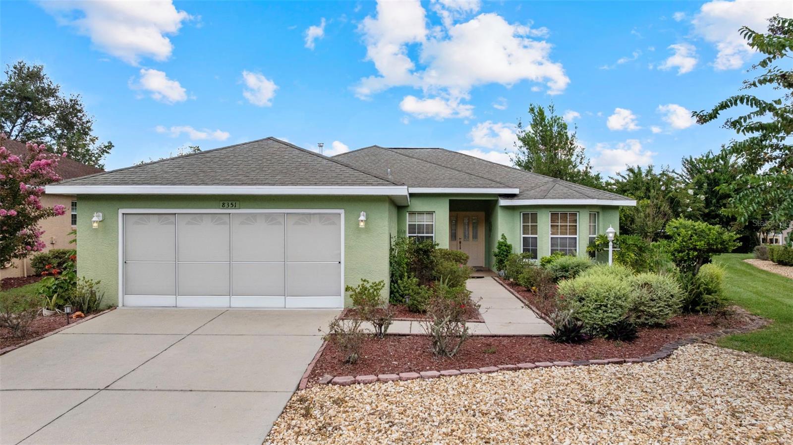 This is the best value in the neighborhood, making it an exceptional opportunity for buyers seeking the Florida retirement lifestyle at an incredible price. Welcome to this light-filled home offering comfort, convenience, and unbeatable value in one of Ocala’s most desirable 55+ communities. Inside, you’ll find an open-concept floor plan with a spacious kitchen featuring abundant cabinetry, stainless steel appliances, and a breakfast bar overlooking the living and dining areas. The split-bedroom layout ensures privacy, while the primary suite offers a large walk-in closet and an en suite bath.Enjoy peaceful mornings and evenings on your covered and screened lanai overlooking a landscaped backyard—perfect for relaxing or entertaining. Additional highlights include a laundry room, tile flooring throughout, and an attached 2-car garage. Community amenities include a resort-style pool, clubhouse, and endless opportunities for social activities, plus golf courses just minutes away. Ocala, known as the “Horse Capital of the World,” also offers beautiful nature trails, vibrant dining, shopping, and top-tier medical facilities—all within easy reach.