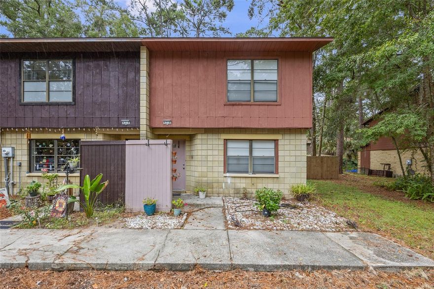 Live easy in this fabulous 2-bed, 1.5-bath end-unit townhome in the quiet, wooded community of Green Leaf!  The moment you step inside, you'll feel right at home in the light-filled living room.  The kitchen, featuring a charming dining area with a new set of French doors, opens to a private, fenced-in backyard with patio—perfect for morning coffee or evening gatherings.  With a convenient half-bath on the main floor, and a full bath and two spacious bedrooms with walk-in closets upstairs, this home has everything you need.  Additional bonuses include a large storage closet under the stairs, a laundry closet complete with a washer and dryer, and laminate wood or tile flooring throughout, except for the stairs which are carpeted.  You can also enjoy peace of mind with a roof, HVAC, and water heater, all replaced in 2019.  Offering unbeatable convenience, Green Leaf is just 2 miles from the Publix at Tower Square for all your grocery needs, and 5 miles from shopping and dining at Celebration Pointe, Butler Plaza, and The Oaks Mall.  With bus routes to University of Florida and Santa Fe College, and quick access to I-75, Archer Road, and Newberry Road, getting around is a breeze.  Plus, it’s an easy stroll to Veterans Memorial Park with its outstanding Veterans Memorial, sports facilities, fitness and nature trails, play areas, and picnic areas.  With a fantastic location, low-maintenance living, and a private outdoor space, this home is the perfect place to live your best life in Gainesville.  Contact us today while this beautiful unit is still available!