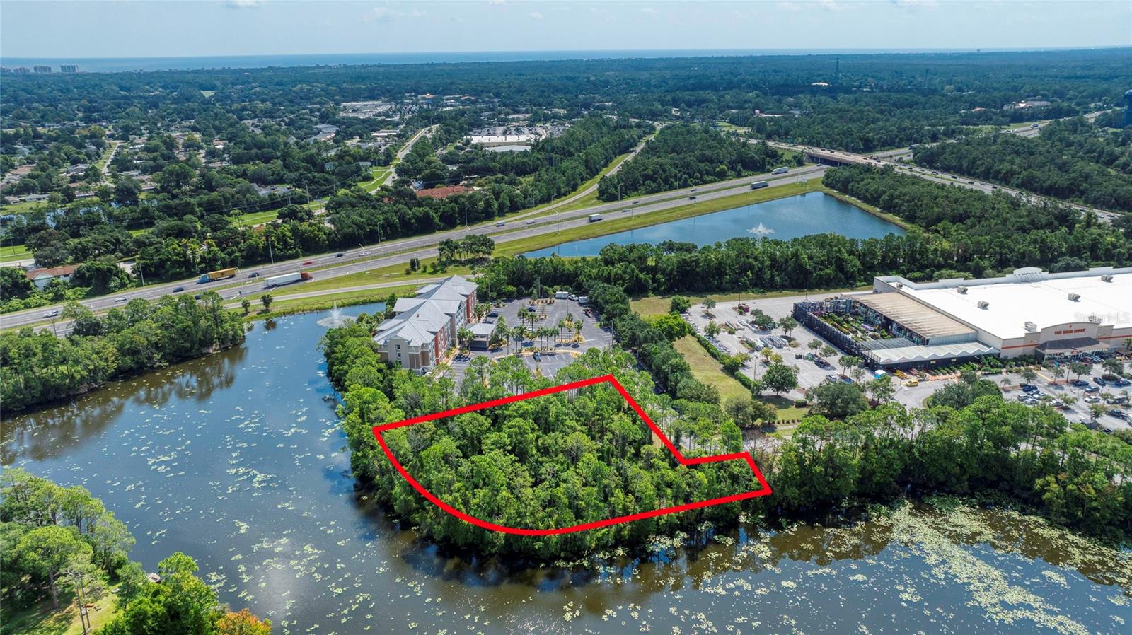 1.36 acre parcel of prime commercial real estate. This unimproved lot is right off of I-95 and Palm Coast Parkway directly adjacent to the Holiday Inn Express & Suites in the Home Depot Center. With 470 ft. of water frontage, it would make a great spot for a restaurant, retail store or professional offices.