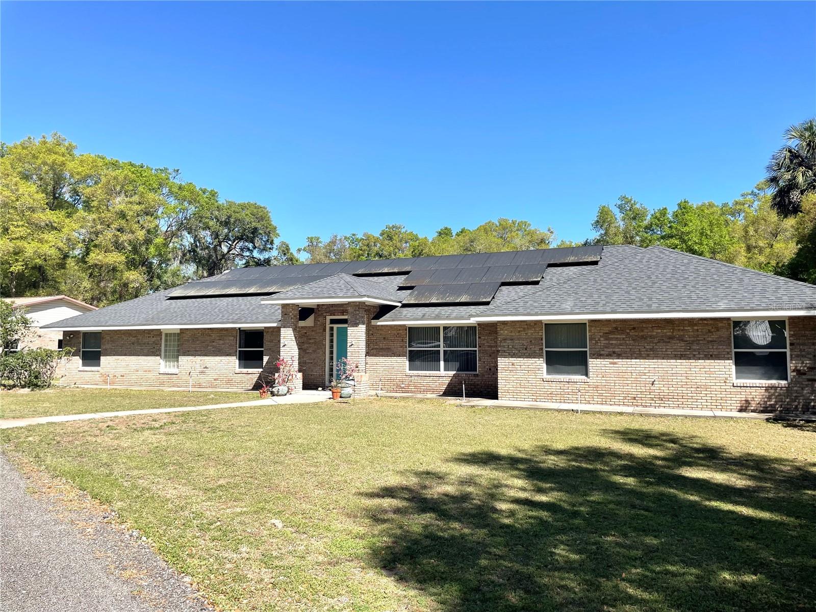 Welcome to your private retreat in the heart of Glenwood. Nestled on 2.4 serene acres, this unique flag-shaped lot offers privacy with a long driveway newly upgraded with millings and set off of a paved road. Zoned agricultural, this property is perfect for those dreaming of a mini farm or those enjoying country living. This spacious 3,092 square foot home features 5 bedrooms, and 4 full bathrooms, including two primary suites, one with a handicap accessible bath-ideal for multi-generational living or guests. Inside you'll find a newly professionally painted interior in a light, neutral gray, creating a fresh, modern feel throughout. The recently renovated kitchen is a chef's dream boasting new cabinets, quartz countertops, a farmhouse sink, kitchen island, and updated appliances. Vaulted ceilings, solar tubes, and indoor laundry add to the home's comfort and functionality and also solar panels for energy efficiency. Comfort is key with two new heat pumps installed in 2022. The roof was replaced in September 2019. Home is covered by a termite bond.
Car enthusiasts or hobbyists will enjoy the 1,764 sq ft 4 plus car garage with drive-thru door for vehicles, equipment, or workspace. Plus, there may be an opportunity to purchase an additional 8.5 acres located directly behind the home. The additional 8.5 acres will NOT be sold until the home is under contract.