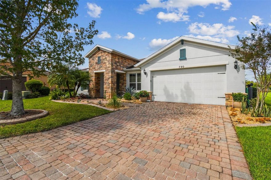 STOP! Don’t miss the photos of this stunning 4 Bedroom, 3 Bath Custom Sorano Model perfectly situated on a quiet cul-de-sac near the Palms Resort Amenity Center. This home has been extensively upgraded—over $150,000 in improvements since March 2024— all thoughtfully designed by the owner/architect. The exterior showcases new custom landscaping and a striking stone façade, setting the tone for what’s inside. Step through the door into an open-concept living area with granite porcelain flooring, custom lighting, and seamless views of the private lanai. Each of the 4 bedrooms features parquet flooring, creating a warm and elegant feel. The custom chef’s kitchen is a showstopper (see photos!)—completely remodeled with a built-in refrigerator/freezer and integrated cabinetry that conceals all appliances for a sleek, modern look. All three bathrooms have been beautifully redesigned, with new cabinets, toilets, and custom tile. The primary suite offers a tray ceiling, a spacious walk-in closet with direct access to the laundry room, and a spa-like en-suite bath featuring a new soaking tub,custom sink, mirror and custom tile work. The newly added lanai is perfect for entertaining, complete with custom tile, pebble stone flooring, and a gazebo for year-round enjoyment. Additional features include a two-car garage with ample storage and an EV hookup. This move-in ready home blends modern elegance with functional upgrades—perfect for both everyday living and entertaining. All this in one of the top 55+ communities in America. Solivita offers residents access to state of the art amenities and work out facilities, dance and aerobics studios, a business center, 14 heated swimming pools, 2 heated spas, tennis courts, pickleball courts, shuffleboard, bocce ball, billiards room, art gallery, 3 restaurants and 2 championship 18-hole golf courses, driving range and putting course. Every day offers something new to explore and enjoy! This home also features easy access to nearby shops,as well as a brand new shopping center that caters to all your needs (including Sprouts) dining, and health care, offering the perfect balance of privacy and lifestyle.