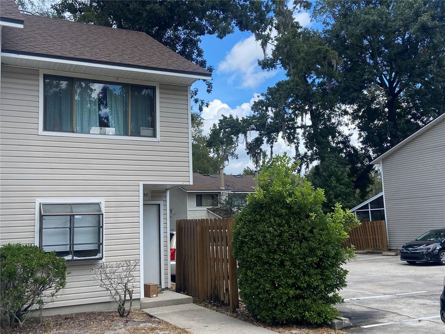 Investor Alert! Currently leased. This charming two-bedroom, one-and-a-half-bathroom townhouse in the Shellrock Villas community offers a convenient and comfortable lifestyle. Being in a prime location close to the Oaks Mall, I-75, North Florida Hospital, and various dining and entertainment options, it is great for primary buyers or investors. The first floor features a well-appointed kitchen, a cozy living room and dining area, a half bath, a utility room with a washer and dryer. Upstairs, both bedrooms and a full bathroom awaits, the primary suite boasts a walk-in closet. The unit was recently updated adding NEW LVP on the stairs and upstairs, newly painted interior and bathroom vanity replaced along with a few other cosmetic upgrades.  The monthly fees include building exterior maintainance taken care of by the HOA, as well as exterior insurance, including the roof. Offering you a low-maintenance lifestyle. Additionally, 2 Assigned parking spots make coming and going a breeze. Schedule a tour to see this charming townhome for yourself or for investment purposes.