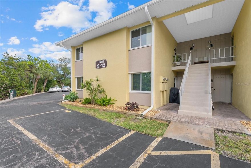 IMPACT GLASS THROUGHOUT!  COMMUNITY HEATED POOL! WATERFRONT! Enjoy the best of coastal living in this beautifully updated two bedroom, two bath second-floor condominium overlooking the peaceful Lyons Bay in Nokomis, FL and ideally located West of the Trail, just moments from the water and beautiful Gulf beaches. Notable HIGHLIGHTS include: Sliding glass doors updated 2025, HVAC and Electrical Panel in 2020, This light-filled residence features an updated kitchen with convenient lower cabinet pull-out drawers, a pantry, and a reverse osmosis (R/O) drinking water system for added comfort and quality. Both bathrooms have been fully renovated with stylish tile showers and single vanities, and custom shelving throughout the home enhances organization and storage. The primary suite offers a private ensuite bath and tranquil water views, while the guest bedroom features built-in bookshelves, adding both character and functionality. Hurricane IMPACT windows and sliders provide comfort and peace of mind. A rare and desirable feature, this condo includes a private laundry room with additional storage space, along with an assigned parking space, there is additional guest parking available. The unit offers convenient dual access with a front entry from the parking area and a rear door leading directly toward the community pool or to the kayak launch! Residents enjoy exceptional waterfront amenities including a heated pool, dock on Lyons Bay, and kayak launch, perfect for embracing the Florida lifestyle. Ideally located less than half a mile from Nokomis Beach, just a couple of blocks from Pelican Alley, Pops Sunset Grill and a marina, walk or bike your way to all your local favorites! This property places Gulf sunsets, boating, and waterfront dining and recreation just moments from your door.  Schedule your showing today!