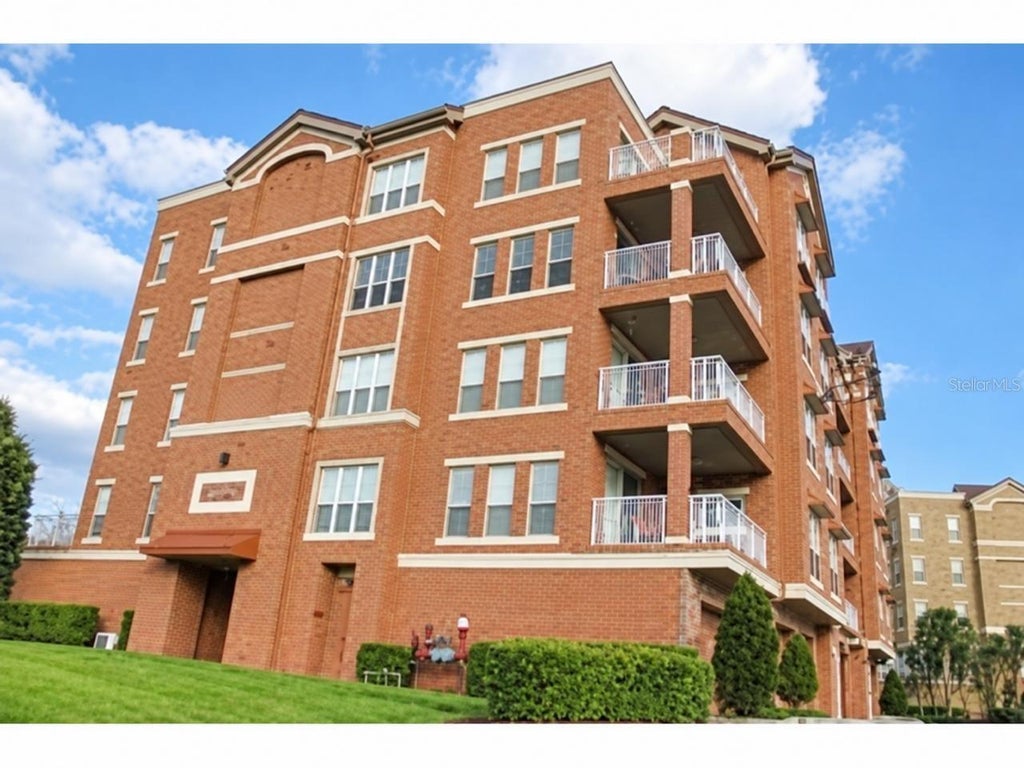 Photo of 7508 Toscana Boulevard #142, Orlando, FL 32819 (MLS # O6448655)