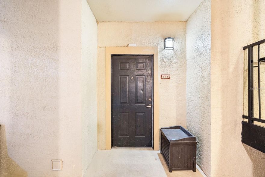 Cozy and UPDATED, FIRST FLOOR 2 bedroom, 2 bathroom condo.  TILE throughout and NEWER carpet in the bedrooms. As you enter, you will notice the beautiful mosiac tile in the foyer and the large living room with BUILT IN shelving.  An area for the dining room and breakfast bar off the kitchen.  The kitchen features NEWER APPLIANCES, TILE backsplash, GRANITE countertops and cabinets with pull out drawers.  INSIDE laundry that INCLUDES the washer and dryer. NEW HVAC, light fixtures and outlet covers.   Primary bedroom has a walk in closet and an UPDATED en suite bathroom. Newly painted inside throughout.  You can relax on your porch and watch the birds fly by!  A lockable STORAGE closet also included on the porch.  The RESORT style community has two pools, hot tub, playground, dog area, a two-story modern gym, billiard room, aerobic/yoga studio, tennis courts, outdoor grilling areas. The HOA covers water, sewer, daily valet trash service and the amenities.  Roof was replaced in 2022.  Located in beautiful Lake Mary, it is close to the Seminole County trail and five minutes from shopping, restaurants and highways.  This home has it all!! Don't wait to schedule your appointment today!!