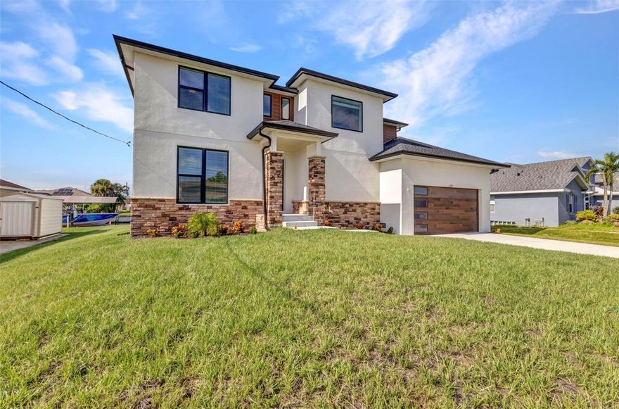 One or more photo(s) has been virtually staged. Under Construction but almost completed. RARE BRAND NEW WATERFRONT CUSTOM HOME IS A BOATERS DREAM! One of a kind CUSTOM BUILT, BRAND NEW waterfront home with 73 feet on the waterway with only 1 bridge to GULF ACCESS with MILLION DOLLAR WATER VIEWS! **$20,000 SELLER INCENTIVE** USE TOWARDS RATE BUY DOWN, CLOSING COSTS OR CASH DISCOUNT! MOVE IN READY NOW! **MAKE AN OFFER TODAY**This home is boasting 4 bedrooms, 2nd floor patio, a flex room which could be an additional bedroom and 3 full bathrooms, perfect for families, those looking for extra space or even as an investment such as renting the home as an AIRBNB OR VRBO. LARGE LAUNDRY ROOM WITH EXTRA STORAGE SPACE. HUGE OVERSIZED GARAGE can accommodate multiple vehicles! This home is ONLY 11 MILES to Englewood Beach! Enjoy waterfront living with direct access to the Myakka river and a PRIVATE BOAT DOCK right in your backyard. There is PUBLIC WATER and septic at this property. Inside you will find a split floor plan that offers both comfort and privacy. The huge great room is open to the kitchen and dinette area. Your fully equipped kitchen features a large ISLAND with QUARTZ COUNTERTOPS, shaker style cabinets including 42" upper cabinets, FRIGIDAIRE range, refrigerator, microwave and dishwasher included! The primary owner's suite is on the first floor and includes an ensuite bathroom and large walk in closet. The first floor also has a dedicated "flex room" which can be an office, exercise room or additional bedroom. Head upstairs to the GAME ROOM and additional bedrooms + full bathroom. With its spacious layout and modern amenities, this house is perfect for entertaining friends and family or simply enjoying a quiet evening at home. Enjoy Florida living the way it is meant to be with a large backyard patio near the water's edge. PLENTY OF ROOM FOR A POOL! Spend your days exploring the Gulf beaches which are just miles away. Don't miss out on this rare opportunity to own a beautiful BRAND NEW waterfront property in a growing a popular North Port location. Schedule a showing today and make this house your new home sweet home! MOVE IN READY NOW! MAKE AN OFFER TODAY!