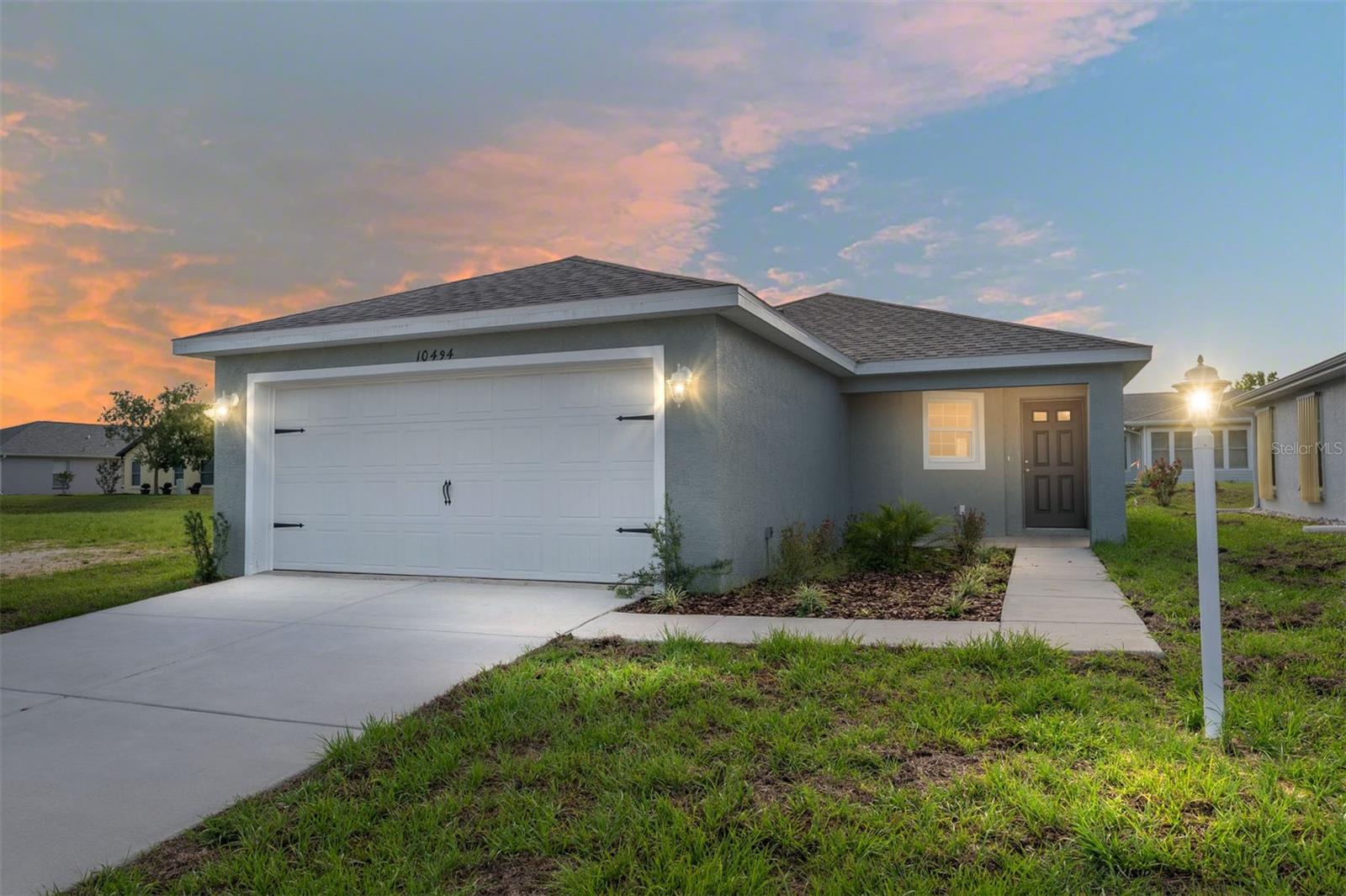 BRAND NEW & MOVE-IN READY | GATED 55+ COMMUNITY Welcome to the Poinciana—a beautifully designed 3-bedroom, 2-bath new construction home in the desirable gated community of Tarawood. This elegant floor plan features tray ceilings, premium luxury vinyl plank flooring, and an open-concept layout ideal for both everyday living and entertaining. The kitchen is a true standout with granite countertops, soft-close Aristacraft cabinetry, and a complete stainless steel appliance package—perfect for the home chef. Unwind in your private covered back patio, ideal for sipping coffee or enjoying peaceful evenings. Tarawood offers the perfect blend of nature, comfort, and community. Nestled in a serene country setting, you're just minutes from the scenic Withlacoochee State Trail and the Tsala Apopka Chain of Lakes—great for walking, biking, fishing, or kayaking. Despite the quiet surroundings, you’re only 15 minutes to Inverness and Brooksville for shopping, dining, and healthcare. No hurricane damage here, yet you're still close enough to enjoy the beauty of Florida’s Gulf Coast whenever you please. Community amenities include a spacious clubhouse, heated pool and spa, fitness center, sauna, and a vibrant calendar of social events. Central water and sewer add to the ease of living. Don't miss your opportunity to own brand-new in one of the area's most sought-after 55+ communities. Schedule your private tour today!