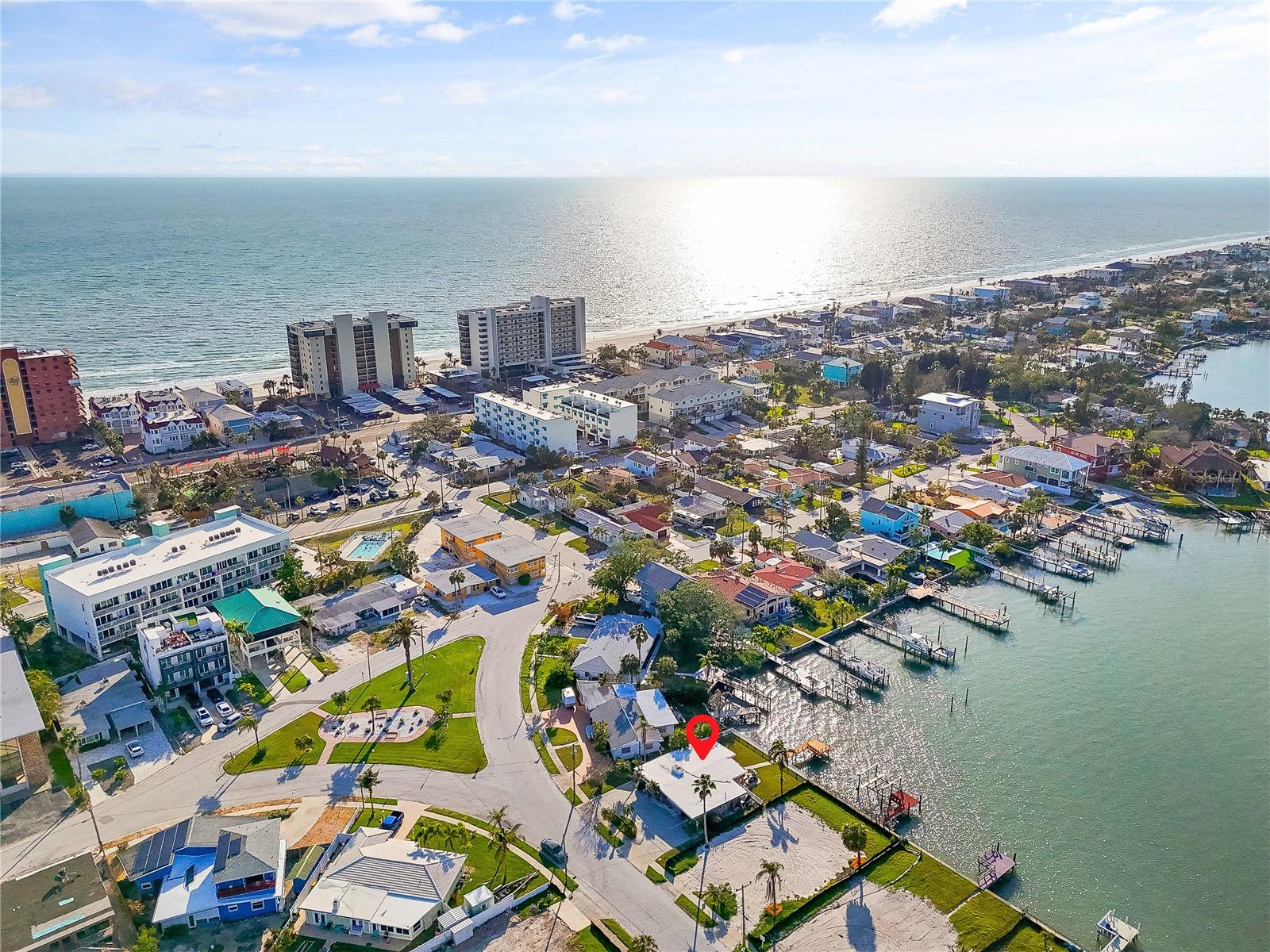 Exceptional Waterfront Opportunity on the Intracoastal Waterway! Don't miss this rare chance to own prime waterfront property with direct Gulf access. Positioned along the scenic Intracoastal Waterway, this parcel features a newer seawall and a private composite dock—perfect for boating, jet skiing, paddleboarding, kayaking, fishing, and embracing the full coastal lifestyle. The existing structure sustained significant hurricane damage and has not been remediated; the property is being sold for land value only, offering a blank canvas for you to design and build your custom waterfront oasis. Ideally located within walking distance to world-class beaches, top-rated dining, boutique shopping, and vibrant local entertainment. Whether you're envisioning a serene retreat or a luxurious showpiece, this is your opportunity to create your dream home in one of the area’s most desirable locations. Schedule your showing today and bring your vision to life.