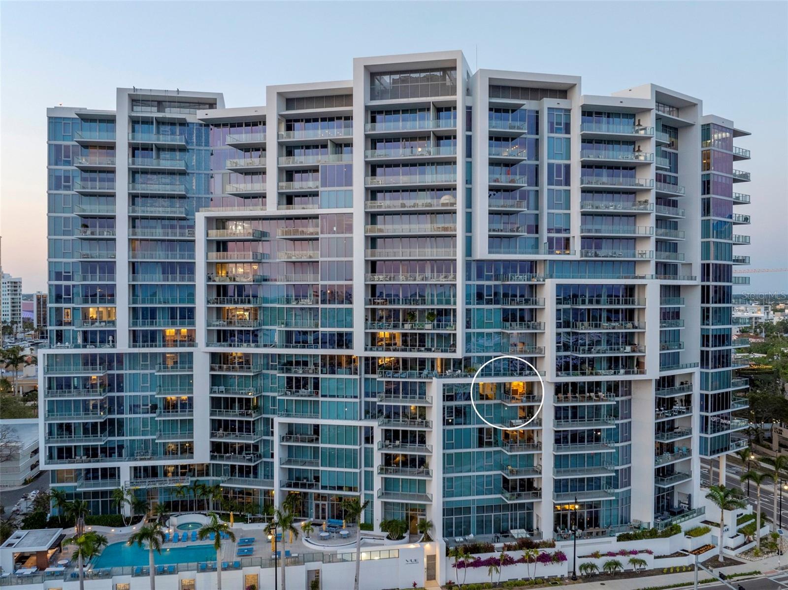 Perfectly positioned to embrace both sunrise and sunset over Sarasota Bay, Golden Gate Point, and the Keys, this exquisite two-bedroom plus den residence offers one of the most breathtaking views in all of Downtown Sarasota and a lifestyle that is second to none. From the moment you step into your private entry foyer, you’re welcomed into a space defined by elevated taste—where custom finishes and sophisticated upgrades create a truly distinctive home. Towering 10-foot floor-to-ceiling windows invite sweeping panoramic views and bathe the open-concept living areas in natural light. From your private terrace you will enjoy a front-row seat to the dynamic beauty of the Bay and marina—where the sights shift with the tides, and your own boat could rest within view. Designed for both culinary inspiration and effortless entertaining, the chef’s kitchen features premium appliances including an induction cooktop, sleek Nolte cabinetry, and a striking Quartz waterfall island. The primary suite has a spectacular view and is your private sanctuary, complete with automated window treatments, custom-designed closets, and a spa-style bathroom that exudes serenity. The guest suite offers equal comfort and privacy with a spacious en-suite bath and walk-in closet, while the convenient den/office and well-appointed laundry room add thoughtful functionality. Beautiful Calcutta Luxor marble in all rooms other than the primary bath with Nuetra white porcelain tile and the guest room with high end carpet. Additional features include two parking spaces and a climate-controlled storage unit. Designer furnishings available under a separate agreement. Life at the VUE Sarasota means luxury at every turn—with 24-hour concierge and valet services, a residents’ club room and conference space, a state-of-the-art fitness center, a resort-style heated pool and spa, an expansive dog park, and an elegant outdoor lounge area. Ideally located just minutes from the Ritz-Carlton, the Westin, Sarasota’s best dining, shopping, the opera house, and world-class cultural venues, this is truly downtown living at its finest. Come experience why this remarkable address is called the VUE.