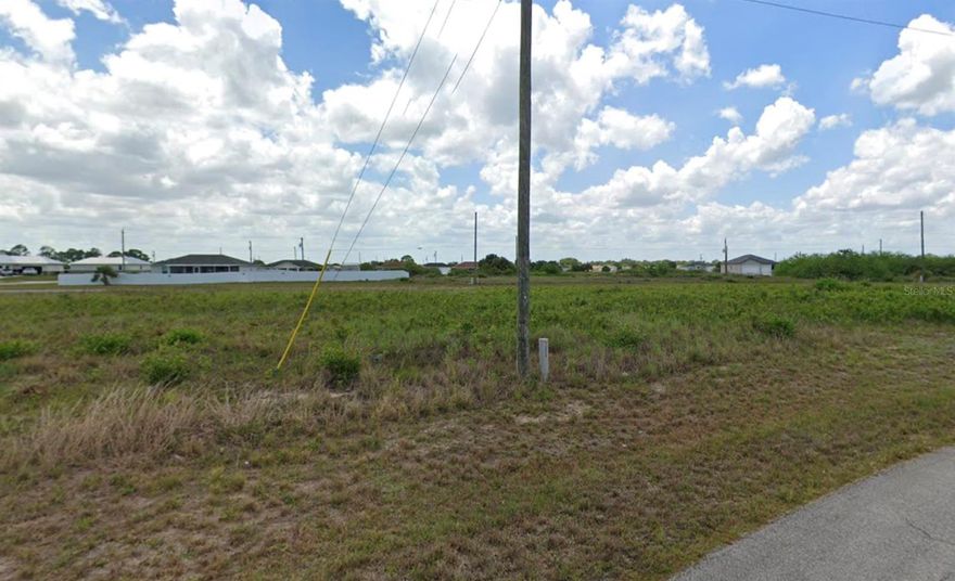 This vacant residential lot is poised for development. The surrounding area offers a tranquil, affordable, and secure environment, conveniently situated at a distance from Miami and Tampa. The community is experiencing rapid growth, making it an ideal location for both investors seeking to construct a single-family residence or families seeking a nurturing environment to grow.
