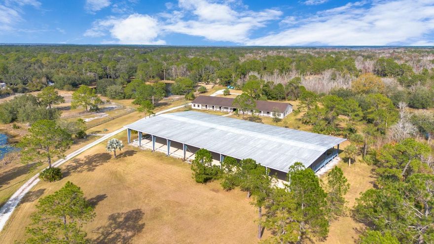 FOR SALE – Prime 35-Acres of land in Geneva, FL. Discover an extraordinary equestrian paradise, carefully designed for the equestrian or business-minded horse enthusiast. This impressive property is turn-key and boasts exceptional amenities. Set amongst a serene, wooded backdrop, with 3 ponds on site, this horse farm is a true gem and has been meticulously maintained. At the heart of the property is the state of the art, 12-stall barn, built by award-winning builder Maroon Fine Homes. The barn features spacious 14'x14' stalls for optimum horse comfort, wide aisles for safety and ease, a tack room, feed room, washroom, storage rooms, central air, and a 1 bedroom, 1 bath lounge (apartment) with an open living room, kitchen, and laundry. Hot water and cold water for both the horses and the living quarters. No equestrian facility would be complete without a covered arena. Measuring 100'x200’ the arena can fit a full-size dressage ring and has imported fiber footing and European mats. Four large “BIG ASS” commercial grade fans have been installed to keep both riders and horses cool year-round. With over 35 acres of land (3 parcels) there is plenty of room for the avid horse lover to expand or to construct a luxurious dream home. No HOA or deed restrictions so the possibilities are endless. While located and surrounded by “Old Florida” beauty in Geneva, FL this rare piece of property is only 30 minutes North East of Downtown Orlando and has convenient access to major roadways. Local grocery stores, shops, and restaurants are about a 10 minute drive away.