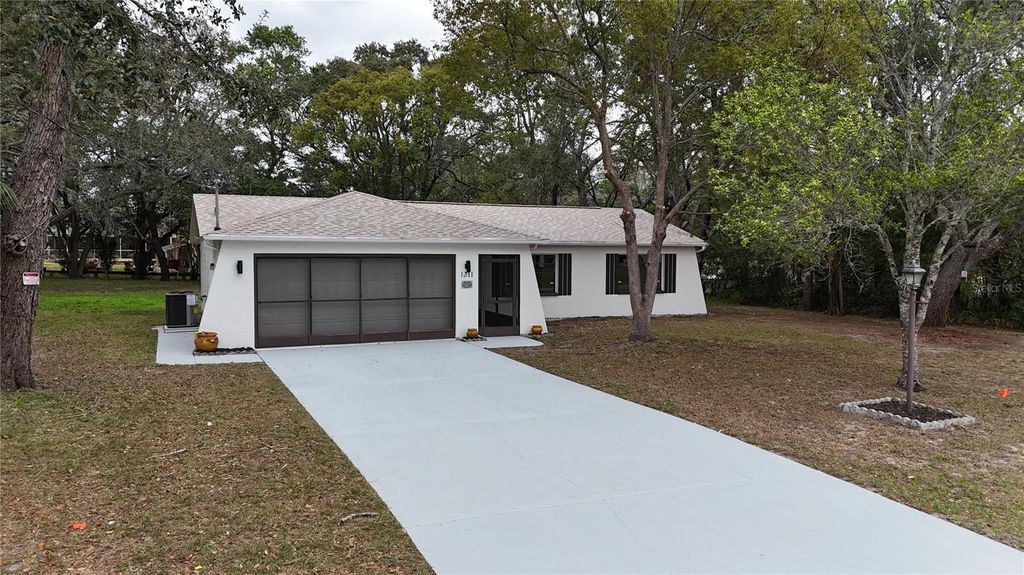 Photo of 1311 Battersea Avenue, Spring Hill, FL 34609 (MLS # W7883898)