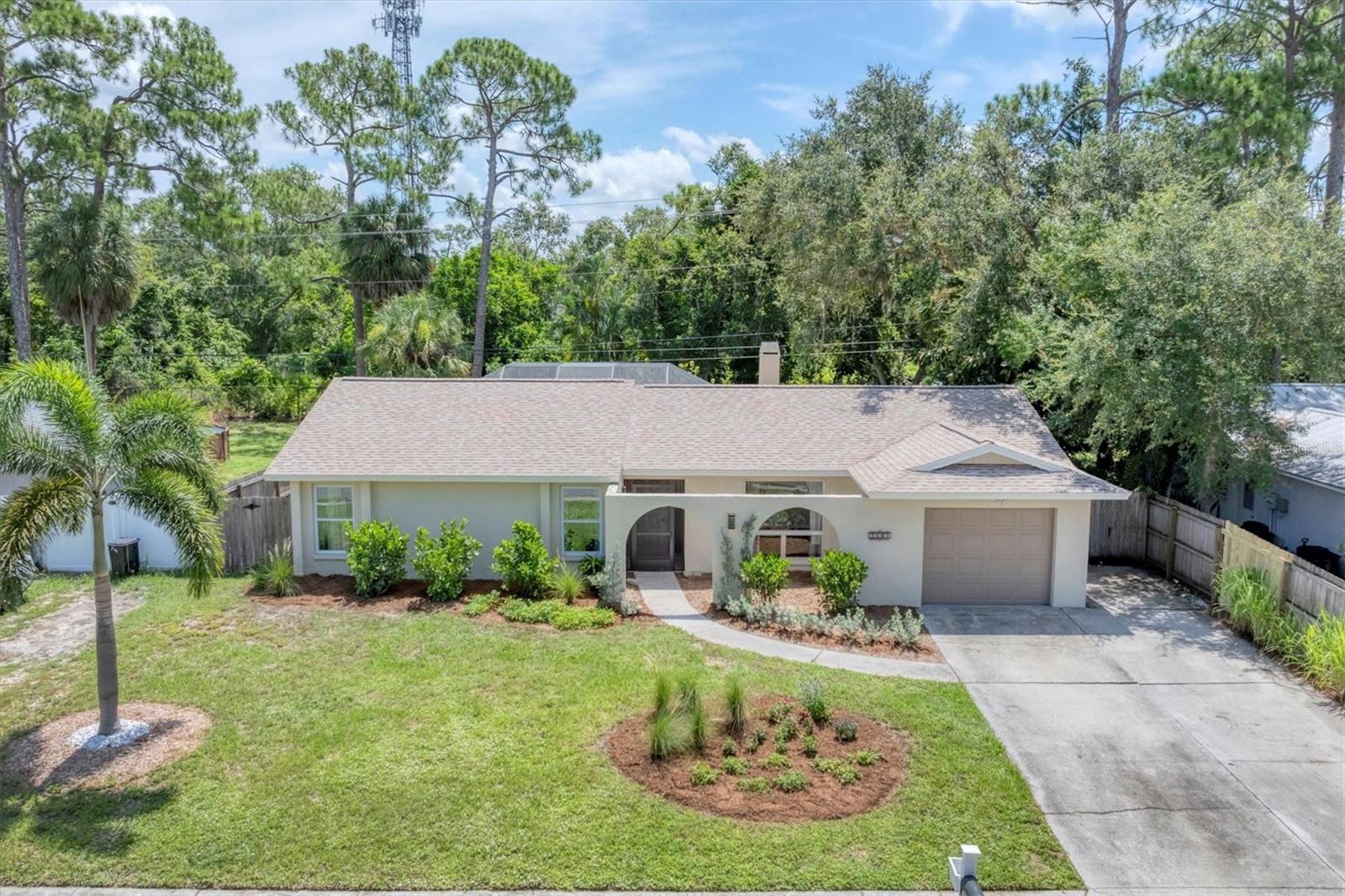 Beautifully renovated and move-in ready, this spacious three-bedroom pool home offers the perfect blend of comfort, style, and location. Recently painted inside and out, all-new stainless steel appliances, laundry room, and the peace of mind provided by a BRAND NEW ROOF with a transferable warrantee. And you'll love the charm of the stone fireplace. Enjoy your own private oasis with a sparkling heated saltwater pool, lush landscaping, and a fully fenced backyard that backs up to peaceful, county-owned wetlands offering extra privacy and a serene natural setting. Ideally situated near Doctors Hospital and just minutes from all the shopping, dining, beaches, and cultural attractions Sarasota has to offer. With no HOA and thoughtful updates throughout, this home is truly a rare find in today's market. Don't miss your chance to own a slice of Sarasota paradise.