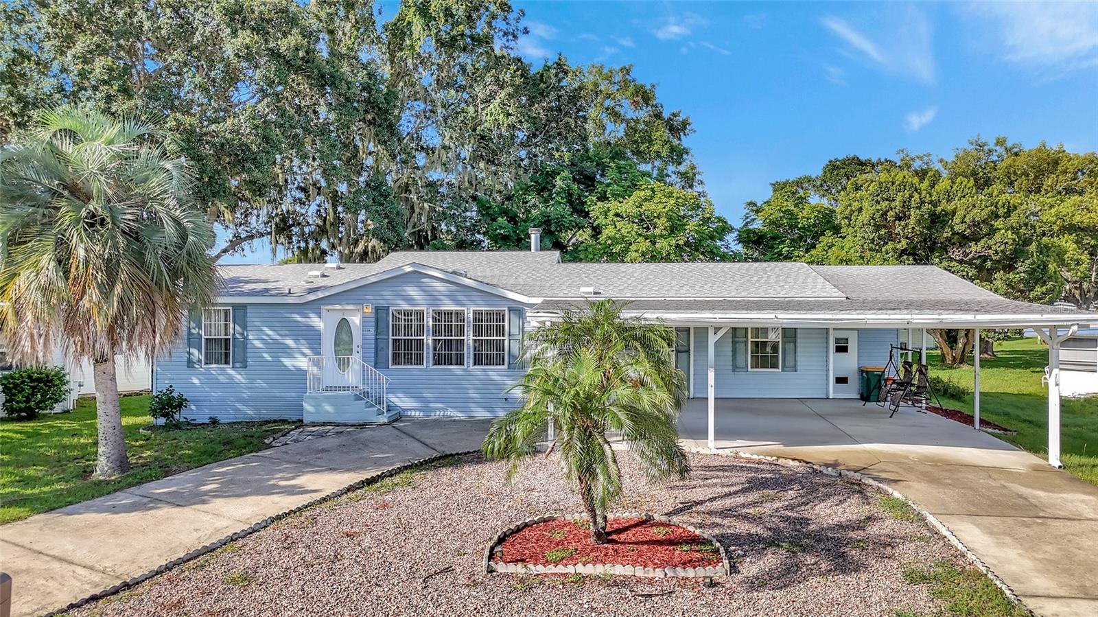 RARE "3" BED / 2 BATH - VIBRANT 55+ IMPERIAL TERRACE! *Seller is offering a $3,000 Flooring Credit at Closing with an Accepted Contract!* This charming double-wide mobile home is a haven of comfort and convenience, offering a delightful blend of serene living and active lifestyle opportunities. “Welcome” begins at curb appeal with easy maintenance landscaping and massive tree shade. Step inside to a spacious Open Floor Plan with an abundance of natural light flooding throughout the home. The main Living areas flow seamlessly for entertaining guests; a wood-burning fireplace brings cozy comfort on chilly days and winter eves - perfect for snuggling, reading a book, or watching a movie! The ‘eat-in’ Kitchen boasts ample counter space and storage for culinary enthusiasts. The Florida Room is always a fav 'go to' with French doors opening up to the main living areas, and a sliding glass door to access the outdoors. The Primary Bedroom provides a peaceful sanctuary, featuring warm wood-grain plank flooring, and EnSuite Bath with Soaking Tub, a separate Walk-in Shower, and Single-sink with oversized Vanity Cabinetry. Split Plan-Two additional Bedrooms and a full-size Bathroom provide flexibility for guests or alternate use ensuring ample space for your needs. EXTERIOR: Built-in Oversized Storage Shed with Front Access and Back Access with Double Doors for Golfcart and/or Mower Parking; Covered Carport and Circle Drive for additional parking. IN ADDITION: Brand New Roof (March 2025) New Back Staircase; Double-Pane Storm Windows (2017). HOA/COMMUNITY: Imperial Terrace is a highly desirable retirement community offering AMENITIES galore! The beneficiary of this fantastic land perk? The OWNER reaps the sweet rewards with a Low HOA Fee – No LOT Rent – You OWN Your Land - for REAL! The Clubhouse is a favorite with resident gatherings, BBQs, swimming, shuffleboard, and so much more. A community Boat Ramp provides easy access to the HARRIS CHAIN OF LAKES - perfect for Owners not living on the canal front to enjoy fishing, boating and water sports. Imperial Terrace is located off Hwy 441, just minutes from the best in Shopping, Dining, Entertainment, County Offices, and state-of-the-art Medical Facilities, PLUS, renowned local destinations - Mount Dora and The Villages! Easily commute to the Beach Coasts, Orlando Attractions, Airports and everywhere exciting that makes Floridians love living ‘central’ in the Sunshine State, year ‘round or Seasonal. Call to schedule your personal tour today!