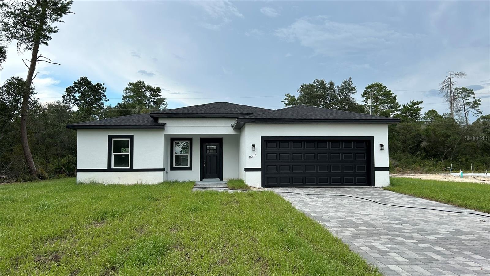 Step into this brand-new 4-bedroom, 3-bath ** Ask about Seller Concessions ** Every detail has been thoughtfully designed, featuring an array of premium upgrades, including a durable epoxy-coated garage floor. Luxury vinyl flooring extends seamlessly throughout the entire home, creating a cohesive and elegant ambiance. The master suite is a true retreat, boasting two expansive walk-in closets and a spa-like bathroom complete with a relaxing soaking tub and stylish fixtures. Some images were virtually staged.