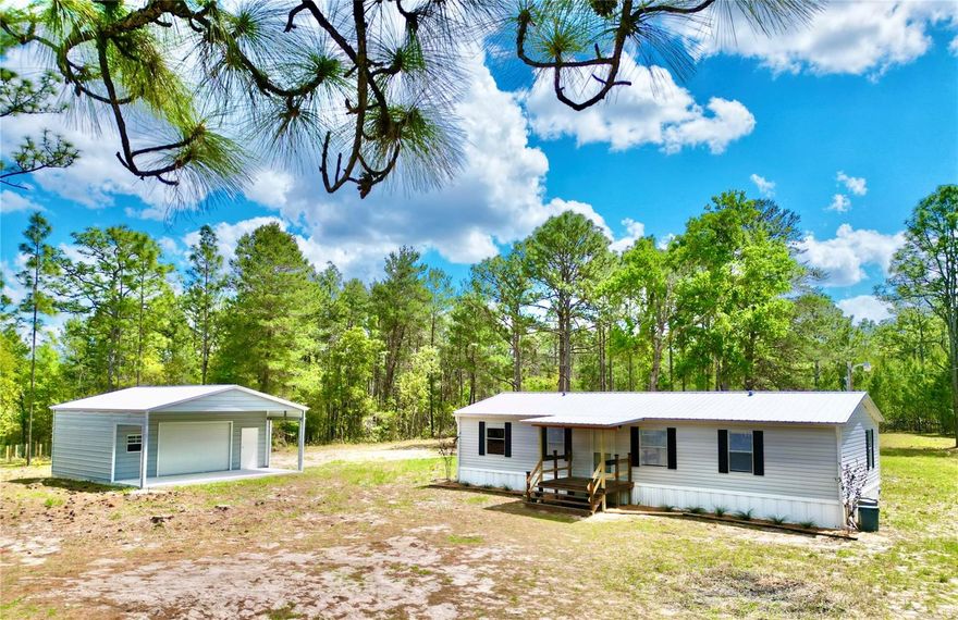 IS NOW THE TIME TO MAKE YOUR MOVE BACK TO SOME COUNTRY LIVING?
Right in the heart of the Lake Region near historic Melrose, Florida. On over 2
acres, is this roomy split floorplan 3-bedroom, 2-bath home. The home has
recently been upgraded and remodeled, including: a metal roof, vinyl flooring
throughout, complete wall finishing, electrical, lighting, plumbing, drain field
and more. Two porches were added to enjoy some outside time cooking out with
friends, family, looking over the chicken pen or sitting quietly watching all types
of wildlife wandering through the property. The main very useful added
improvement to this property is the new 30 x 26 metal building with cement
flooring. Which includes a 10 ft overhang for carport or work area. This property
is centrally located for an easy commute to Gainesville, Palatka, and Ocala
Florida but especially Historic Melrose nearby where you’ll find 6,000 acre
Santa Fe Lake for all your water recreational needs like wake surfing, skiing,
tubing, kayaking, fishing, sailing and more. Melrose is a one light town full of life
and many activities. Here you’ll find several restaraunts, doctors, art galleries,
various arts and crafts classes, regular musical events, dances, art walks,
vendors & more. The town is known for its vibrant cultural life. You’re
encouraged to do a drive-by of the home, but make sure you include driving
through the Historic District of Melrose, see Santa Fe Lake and meet some folks
while there. We think this little big town will have all you’ll need . Yes, it’s a
different way of life out here, but it’s one you’re gonna love when you settle in.
We’ll make it easy to show for ya.
