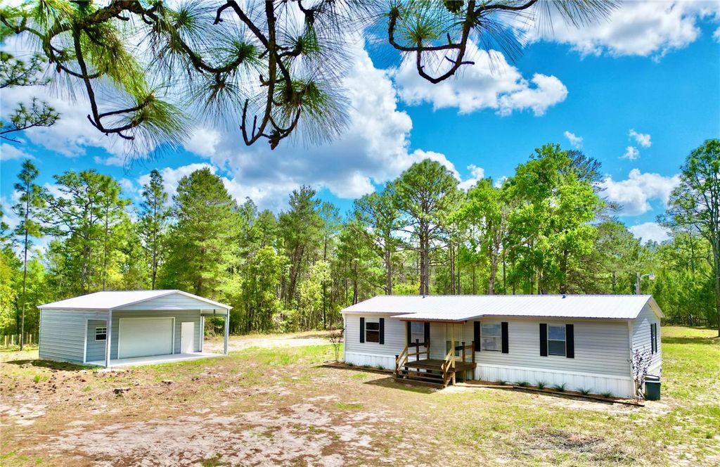 Photo of 175 Whirlwind Loop, Hawthorne, FL 32640 (MLS # GC539140)