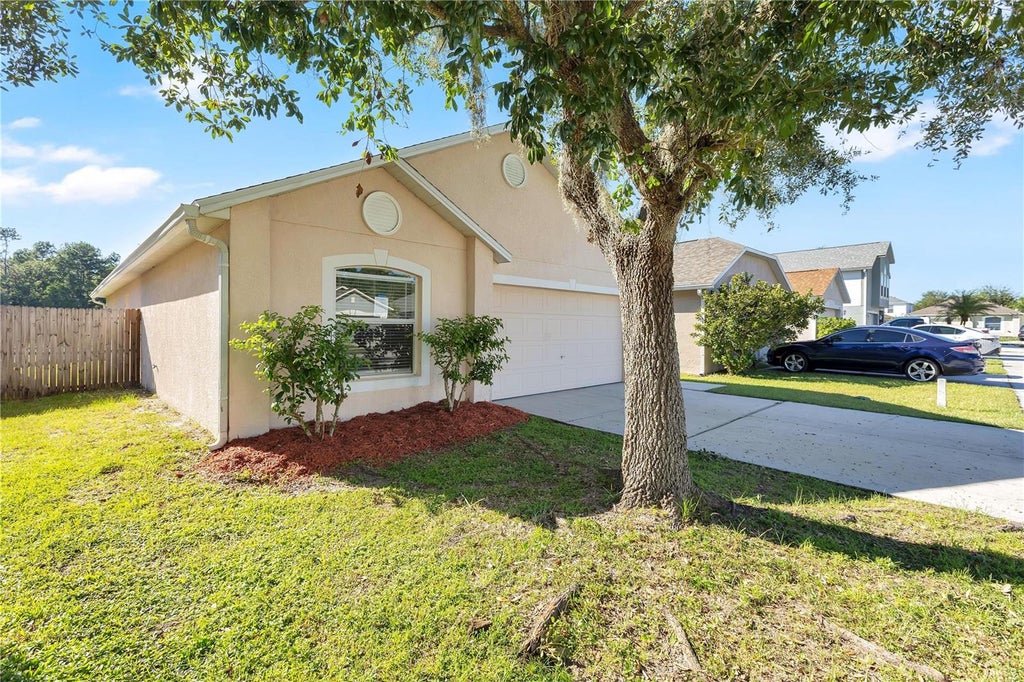 Photo of 6407 Tabogi Trail, Wesley Chapel, FL 33545 (MLS # O6445046)