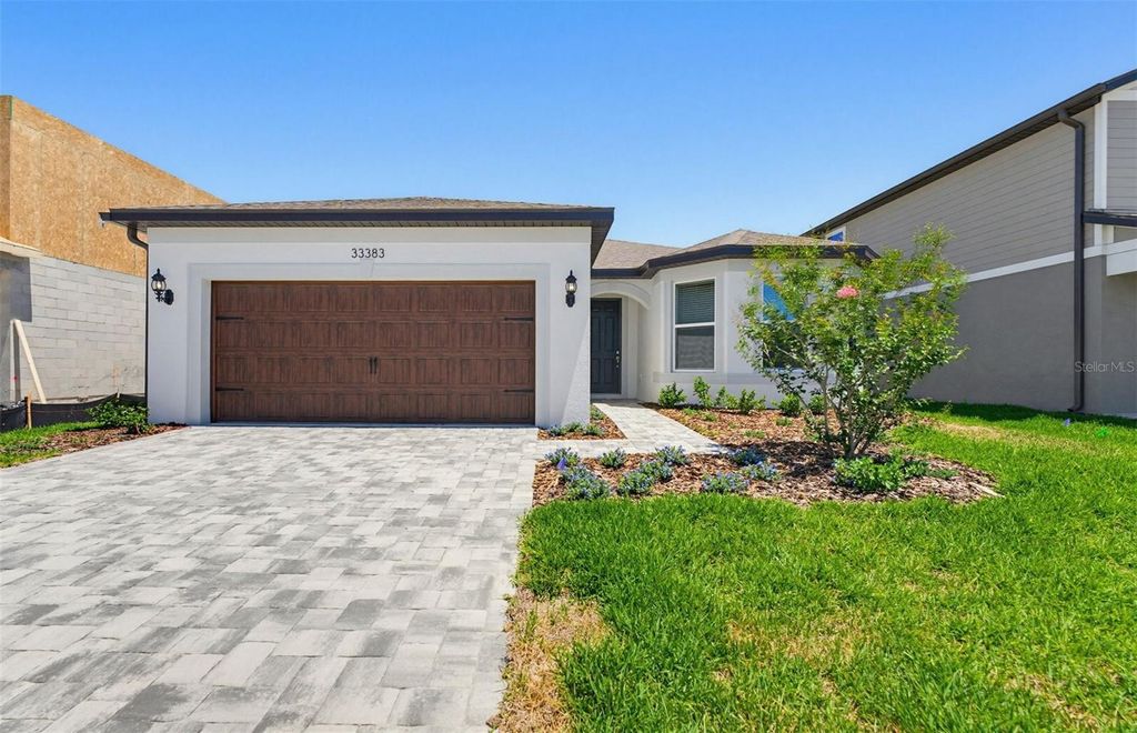 Photo of 33383 Herds Hallow Way, Wesley Chapel, FL 33545 (MLS # TB8489398)
