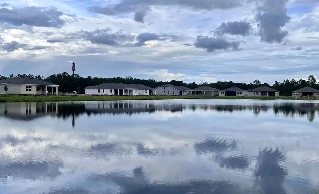 Photo of 6449 Shimmering Shores Lane, Saint Cloud, FL 34771 (MLS # O6386629)