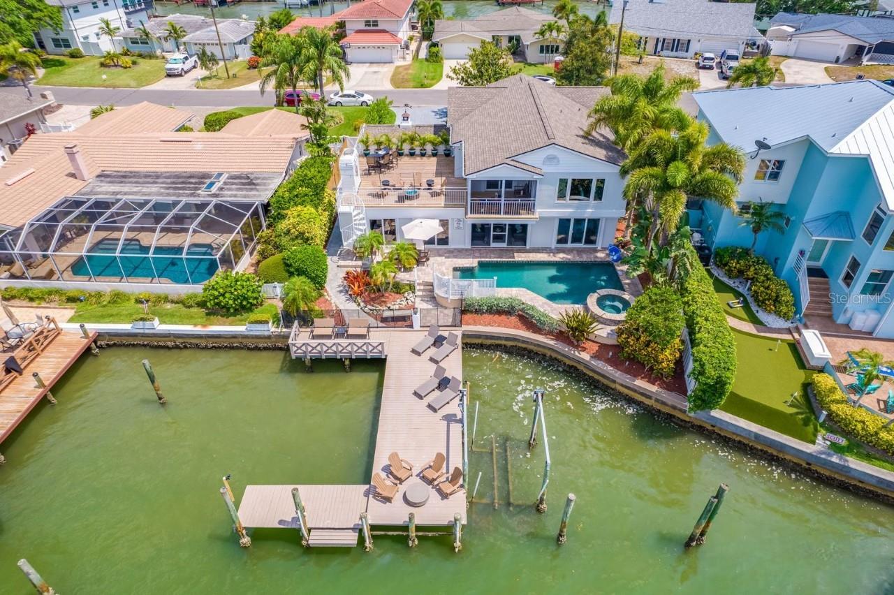 Welcome to this beautifully maintained 2-story home in the highly sought-after waterfront community of Harbor Hills. Spanning 3,900 sq. ft., this spacious residence features 8 bedrooms, 4 bathrooms, and a 2-car garage, offering the perfect blend of space, comfort, and Florida lifestyle. Step inside to discover a layout ideal for large families or multi-generational living. The home boasts an impressive circular driveway, lush tropical landscaping, and prime waterfront views for serene everyday enjoyment. Whether you're relaxing in your private backyard or entertaining indoors, this home delivers on style and function.
The property operates as a turnkey Airbnb investment, offering immediate income potential from day one. Whether you’re seeking a high-performing vacation rental or a second home to enjoy the Florida lifestyle a few times a year, this residence offers the best of both worlds — personal use and exceptional passive income when not in use.