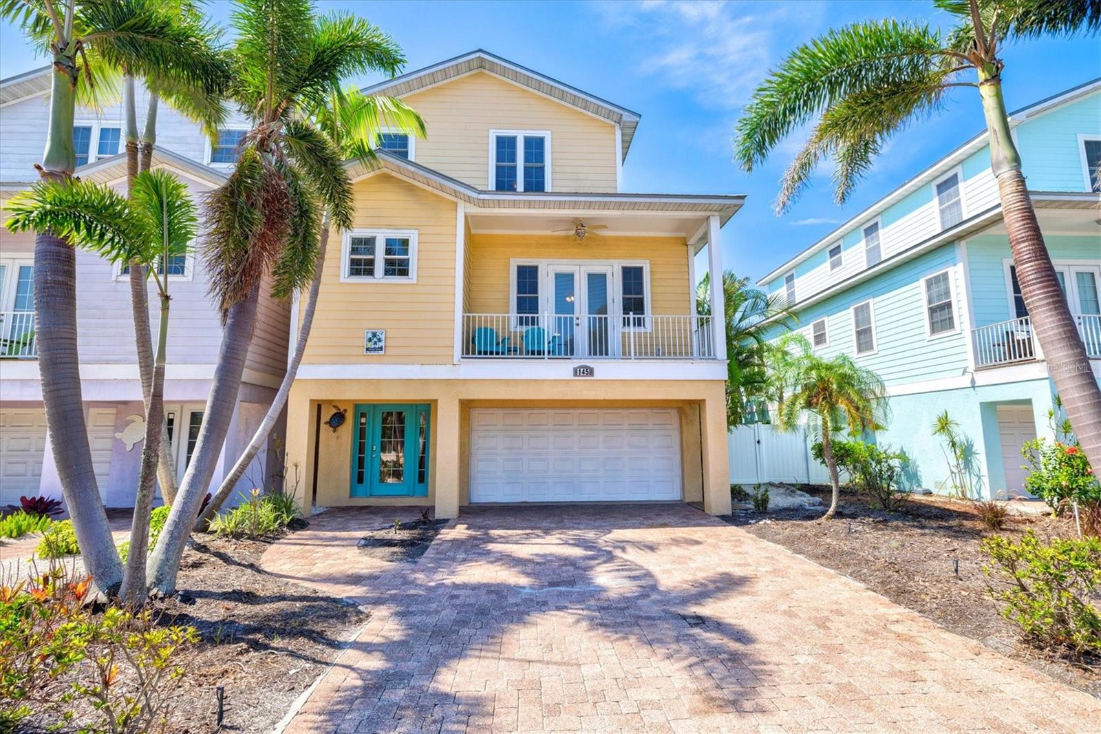 Welcome to Mango Tango, a beautifully appointed 4-bedroom, 3.5-bathroom coastal retreat located just a short stroll (less than three blocks) from the pristine sugar white sands and sparkling turquoise waters of the Gulf of Mexico. Currently operating as a successful vacation rental, this home offers the perfect blend of island charm and modern comfort! Step outside into your private tropical oasis where lush landscaping surrounds a heated pool and a shaded lounge area, ideal for relaxing or entertaining. Whether you’re sipping coffee on the front balcony, firing up the grill for a poolside dinner, or unwinding under the covered patio, you’ll find peace and privacy at every turn. The open concept interior is decorated with a coastal-inspired décor, featuring a spacious family room that flows seamlessly into the dining space and a kitchen equipped with stainless steel appliances and a breakfast bar. It’s the perfect setting for gathering with family and friends.Located in the heart of Holmes Beach, you’re within walking distance to everything that makes Anna Maria Island special: beautiful beaches, boutique shopping, local art galleries, restaurants plus convenient free trolley stops! Leave the car behind and embrace the laid-back island lifestyle! Whether you're looking for a personal getaway, an income-generating rental, or both, this 4 bedroom island gem you've been waiting for!