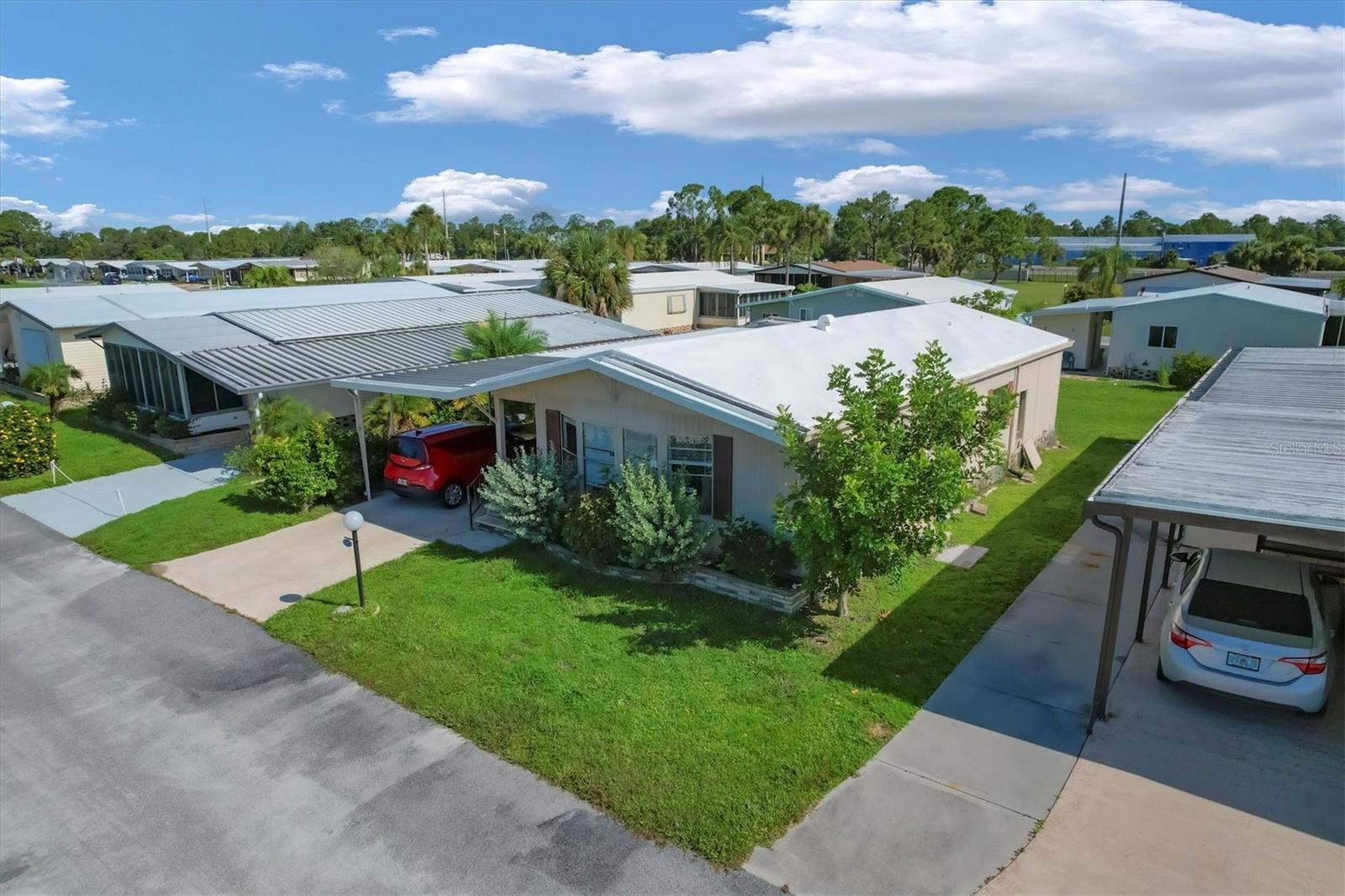 Welcome to the highly sought-after 55+ community of Lazy River Village, where location truly matters! NEW HVAC INSTALLED FEBRUARY 2025. This mobile home offers a perfect blend of comfort and convenience. With two bedrooms, two baths, and an inviting Florida room, this charming property is ready to become your ideal winter retreat or full-time residence. This home has a unique split bedroom floor plan, each of the bedrooms offers a private bathroom so you have two primary suites. Vaulted ceilings and large rooms with new flooring and a new water heater give this home an advantage. This home is located just steps from the clubhouse and all the amenities of this waterfront community. If you enjoy activities, you will have plenty to choose from in Lazy River Village amenities including a fitness center, pickleball, tennis, shuffleboard, golf putting greens, parks, lakes with fountains, bike clubs, card clubs, and pontoon boating and marina, and even a professional woodworking shop. Additionally, the park provides storage for your boat, RV, and even your kayak for an additional fee. It is about 20 minutes from the beautiful beaches of southwest Florida. Within a short drive, you'll find yourself in the vibrant downtowns of North Port, Venice, Sarasota, and Punta Gorda, with an abundance of shopping, dining, and cultural experiences. For sports enthusiasts, the nearby Wellen Park houses Cool Today Park, the spring training facility of the Atlanta Braves, and the Tampa Bay Rays spring training facility is also a short distance away. With its central location, reaching major airports such as Sarasota, Punta Gorda, Ft Myers, St. Pete, and Tampa is a breeze, thanks to convenient access to I-75. Embrace the best of Florida's warm climate and year-round sunshine, whether you make this your permanent residence or your seasonal sanctuary.