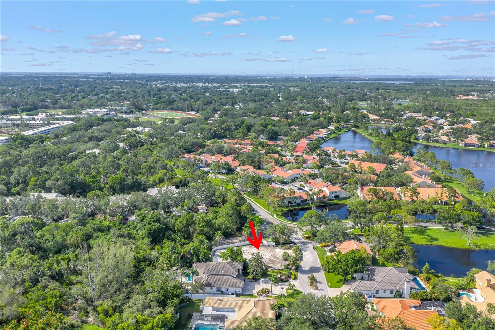 Take advantage of this RARE CHANCE to build your dream home on a spacious, nearly half-acre lot in one of only two gated communities in Northeast St. Petersburg—Placido Bayou. This exclusive, guard-gated neighborhood offers a tranquil lifestyle with scenic lakes, walking and running paths, and mature trees that provide natural beauty and shade. Twelve tall palm trees add significant ambiance to the property. Ideally located just minutes from downtown St. Petersburg’s vibrant waterfront, you'll enjoy world-class dining, boutique shopping, art galleries, museums, and more. The community is close to top-rated schools, stunning beaches, airports, and premier golf courses. Plus, the St. Petersburg Racquet Club is right at the entrance, offering top-notch tennis and pickleball facilities. Don’t miss this rare opportunity to build your custom home in one of St. Pete’s most sought-after and secure neighborhoods—Placido Bayou.