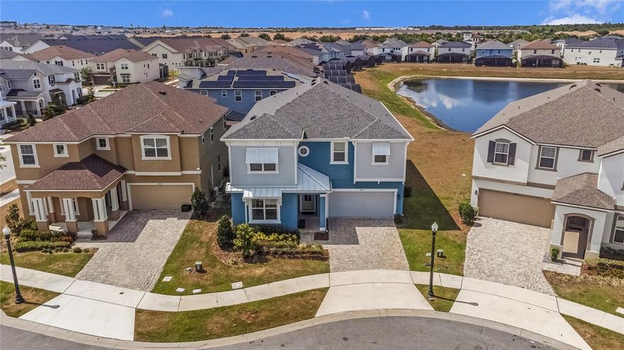 If you're searching for a turnkey, custom-designed luxury short-term rental or vacation property in the heart of Kissimmee, look no further! This fully furnished 9-bedroom, 6.5-bathroom house, built in 2022, epitomizes sophistication and comfort. The home features an open floor plan perfect for entertaining guests and large family gatherings. It includes a spacious family/dining room combo, a designer kitchen with a large island, and a spacious loft on the second floor converted into a home theater. Enjoy the large heated pool with a spa and a huge covered lanai. There's one master suite downstairs and 8 well-themed bedrooms upstairs. The garage has been transformed into a game room. Situated on a beautiful lot with a pond view, the property offers great privacy. Solara Resort boasts one of the most amazing clubhouse amenities with a gated entrance, full-service restaurant, ice cream parlor, coffee bar, fitness center, games room, and outdoor activities including basketball, beach volleyball, and soccer field. Water enthusiasts and sun lovers will enjoy the zero-entry pool surrounded by cabanas, poolside tiki bar, and splash pad. Ideally located just a short distance from 192, this delightful short-term rental community provides easy access to major highways I-4 and US-27. Plus, it's only a few miles away from theme parks, attractions, malls, outlets, local restaurants, and grocery stores.