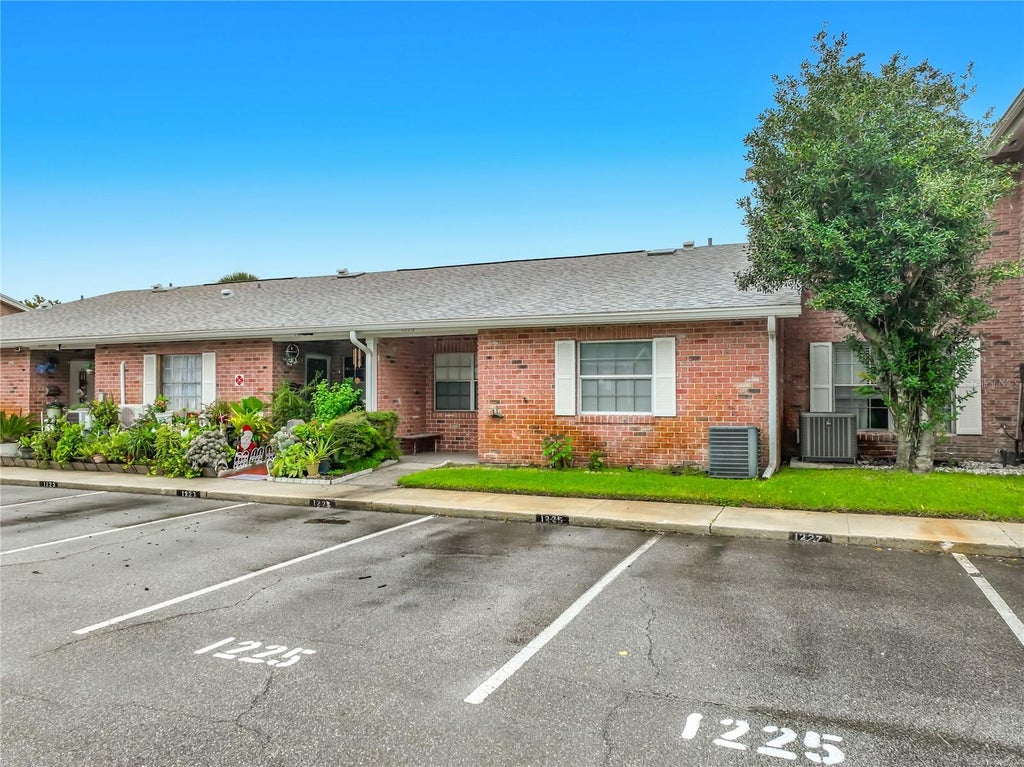 Photo of 1225 Carriage Lane #1, Orlando, FL 32807 (MLS # O6447144)