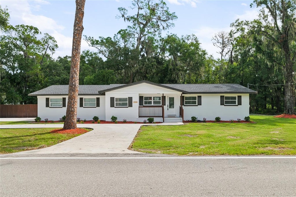Photo of 1725 Walker Road, Lakeland, FL 33810 (MLS # TB8549624)
