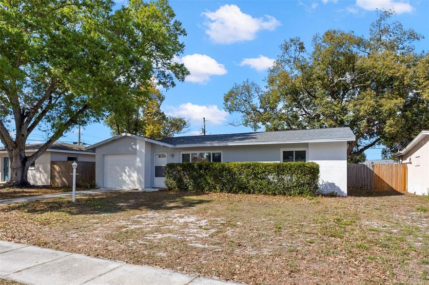 Welcome to 1712 Carlisle St in Clearwater, Florida, a beautifully updated home located in the desirable Sunset Lake Manor neighborhood just minutes from world-famous Clearwater Beach. Situated in a non-flood zone, this well-maintained 2-bedroom, 1.5-bath residence offers an open and light-filled floor plan and a large fenced homesite perfect for enjoying the Florida lifestyle. The home features major system updates completed in 2019, including the roof, HVAC system, and hot water heater, providing valuable improvements for the next owner. Updated windows in the main house for energy efficiency The kitchen has been tastefully updated with quartz countertops, custom white shaker soft-close cabinetry, and stainless steel appliances, creating a stylish and functional space for everyday living and entertaining. Luxury vinyl plank flooring runs throughout the home, and the layout offers comfortable living with abundant natural light. The home includes multiple flexible living spaces, including a large air-conditioned back sunroom (Sq Footage Not included in Total) and a spacious screened lanai, ideal for relaxing or entertaining year-round. A full-size washer and dryer are also included for added convenience. The oversized fenced backyard features a firepit area and a separate fenced dog run, providing plenty of space for pets and outdoor enjoyment. An attached garage offers additional storage and convenience. One of the greatest highlights of this home is its prime Clearwater location. The property is just 10 minutes from Clearwater Beach and the Gulf, and only minutes from Downtown Clearwater, Coachman Park, and The BayCare Sound waterfront music venue. Sports fans will appreciate the close proximity to the Toronto Blue Jays Spring Training facility at TD Ballpark in nearby Dunedin, while golf enthusiasts have easy access to several nearby courses including the Clearwater Country Club and Dunedin Golf Club. Outdoor lovers will enjoy quick access to the Pinellas Trail for biking and walking, and nearby Downtown Dunedin offers waterfront parks, local breweries, restaurants, shops, and year-round events. Everyday conveniences including Publix, shopping centers, restaurants, and medical facilities are all nearby, along with quick access to US Highway 19 and Gulf to Bay Boulevard, making commuting throughout Tampa Bay simple. Tampa International Airport (TPA) and Clearwater International Airport (PIE) plus the vibrant downtown St. Petersburg are also within a comfortable drive. This home offers the perfect combination of comfortable living, outdoor space, and an unbeatable location near Clearwater’s beaches, parks, entertainment, golf courses, and spring training facilities, making it an excellent opportunity for a primary residence, vacation home, or investment property in one of Pinellas County’s most desirable coastal communities.